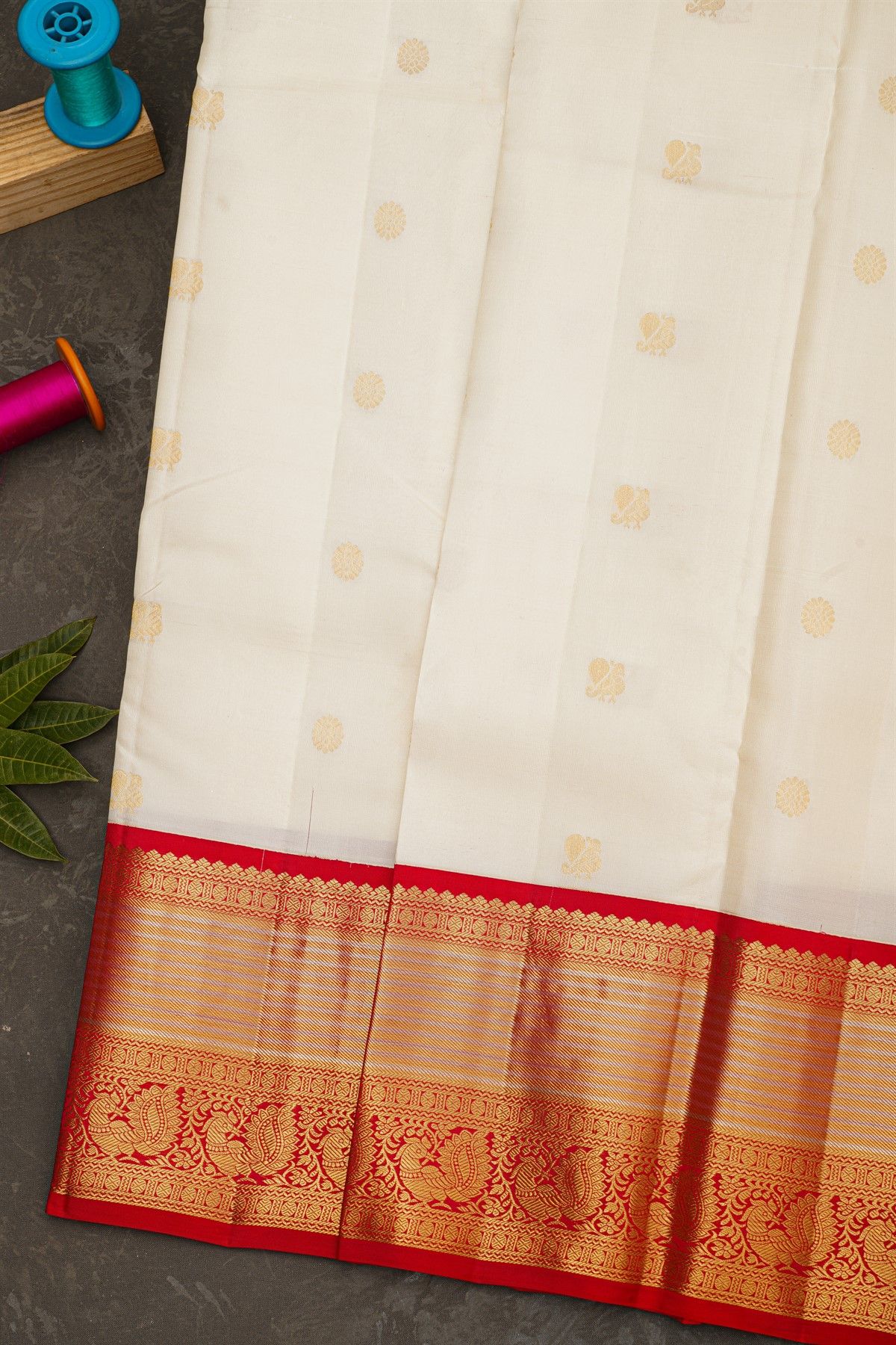 Kancheepuram Silk Off White Saree With Florals And Peacock Buttis Body