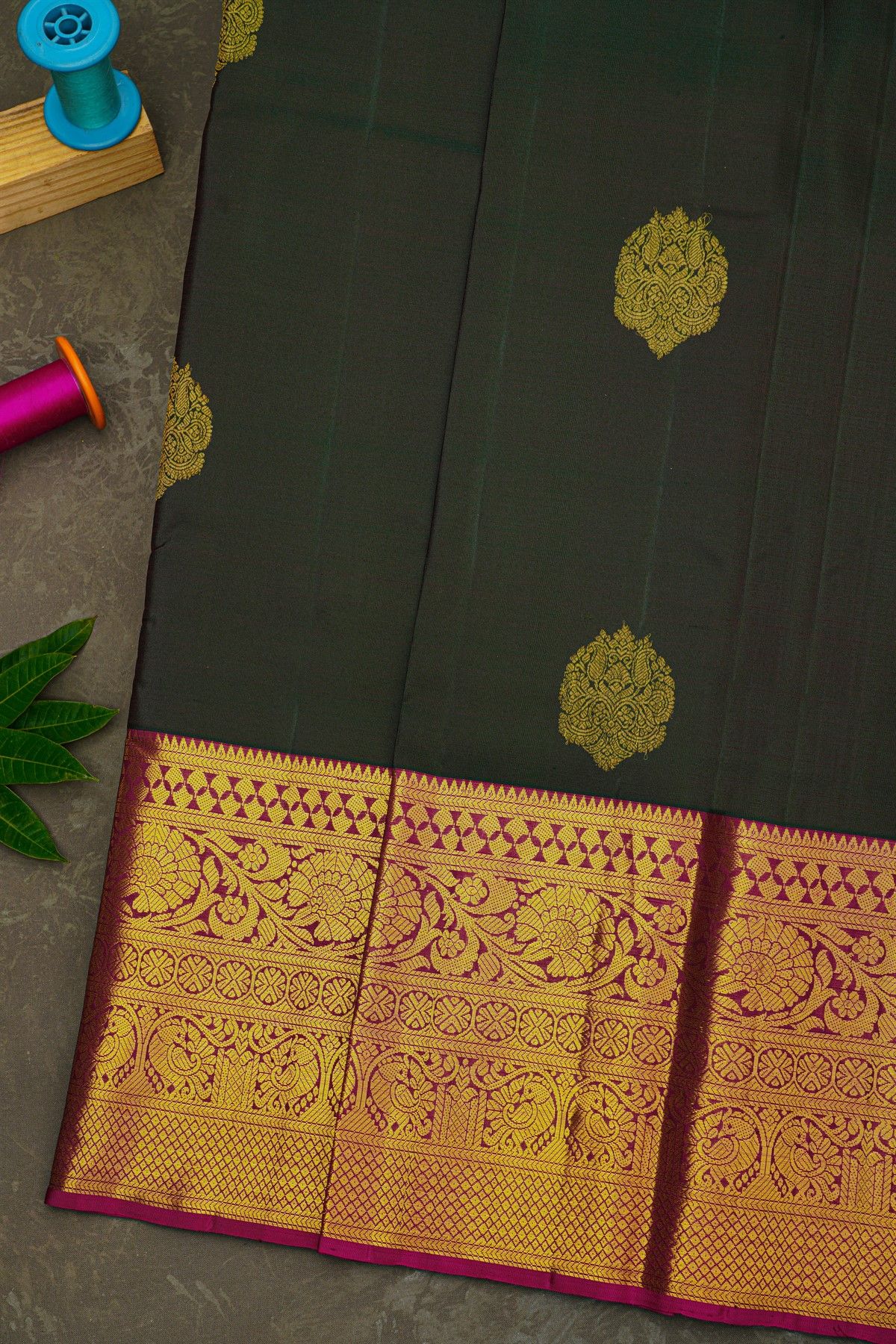 Kancheepuram Silk Bottle Green Saree With Florals And Leaves Jaal Border