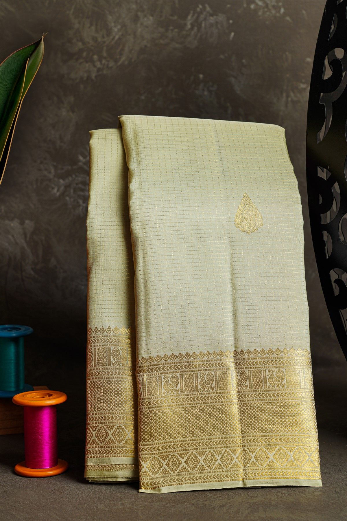 Kancheepuram Silk Off White Saree With Zari Buttis And Peacocks Border
