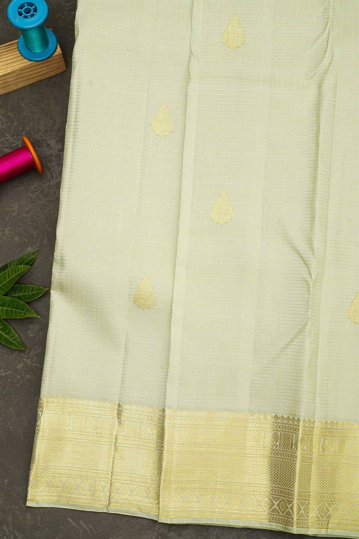 Kancheepuram Silk Off White Saree With Zari Buttis And Peacocks Border