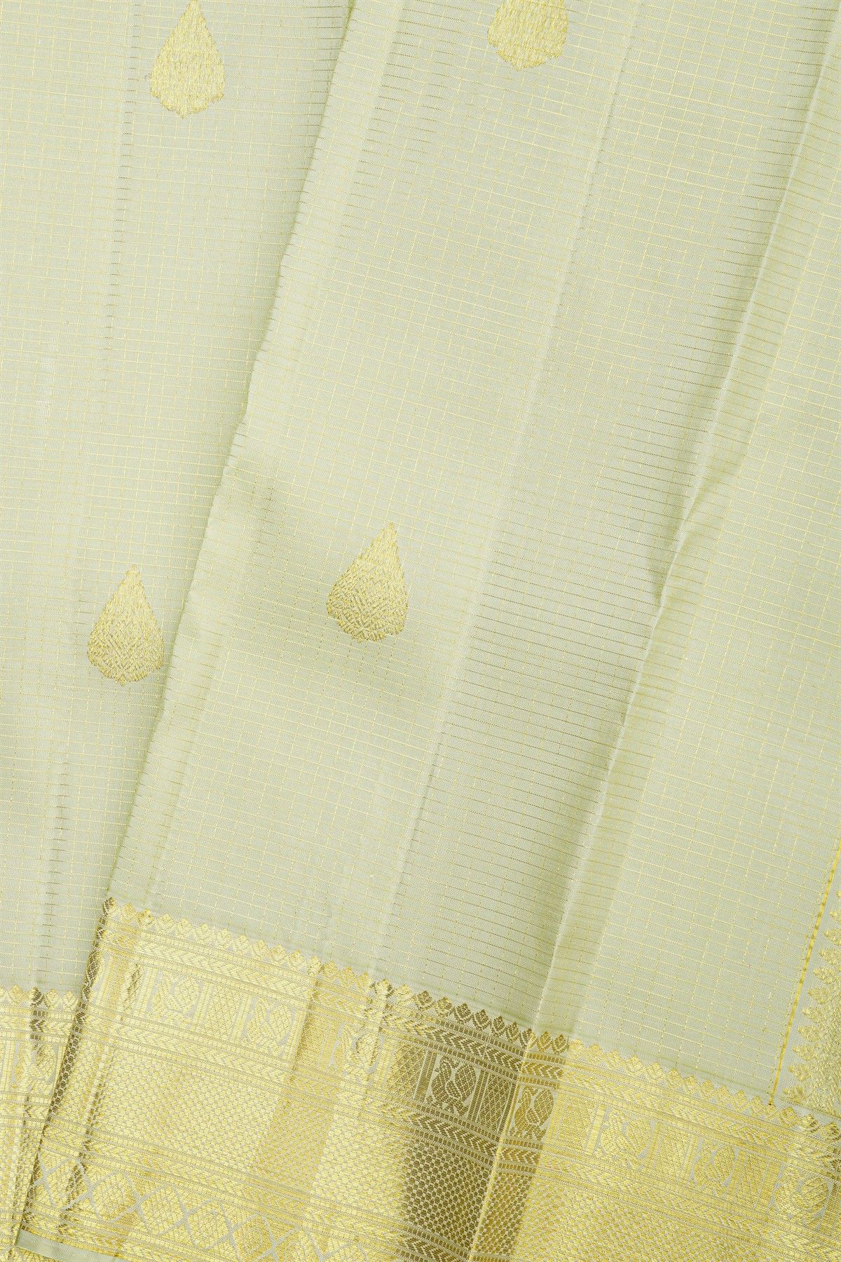 Kancheepuram Silk Off White Saree With Zari Buttis And Peacocks Border