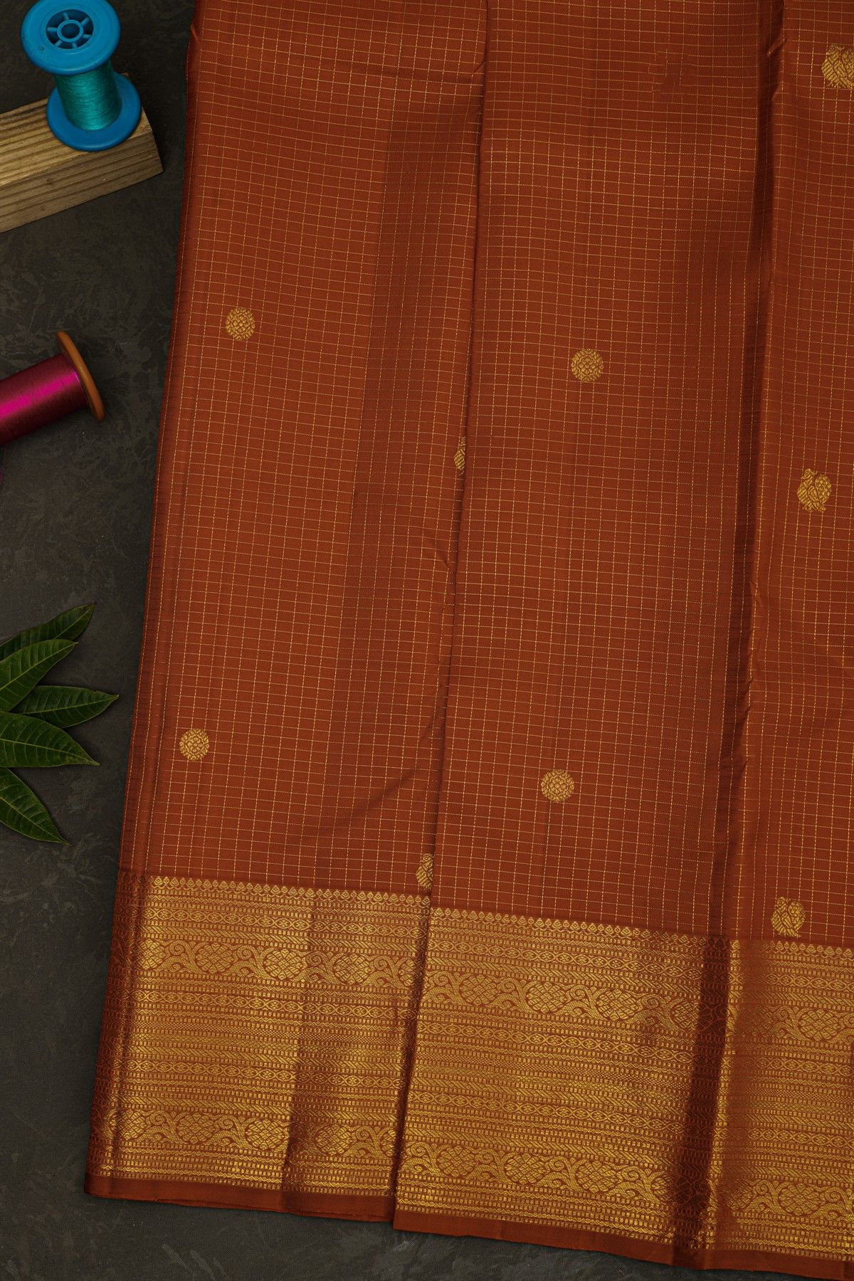 Kancheepuram Silk Rust Brown Saree With Checks Florals And Buttis Body