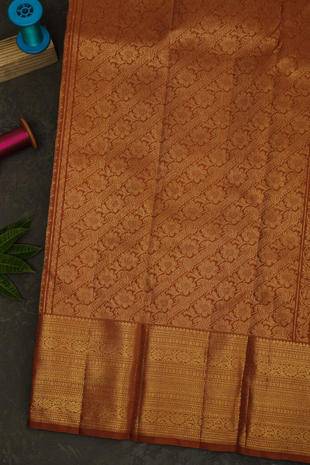 Kancheepuram Silk Rust Brown Saree With Checks Florals And Buttis Body