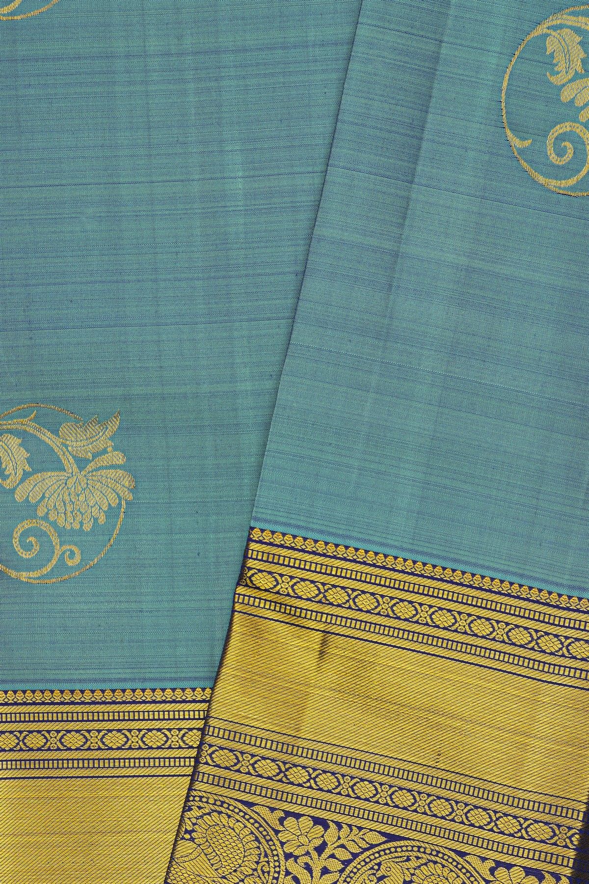 Kancheepuram Silk Blue Saree With Florals And Leaves In Zari Body