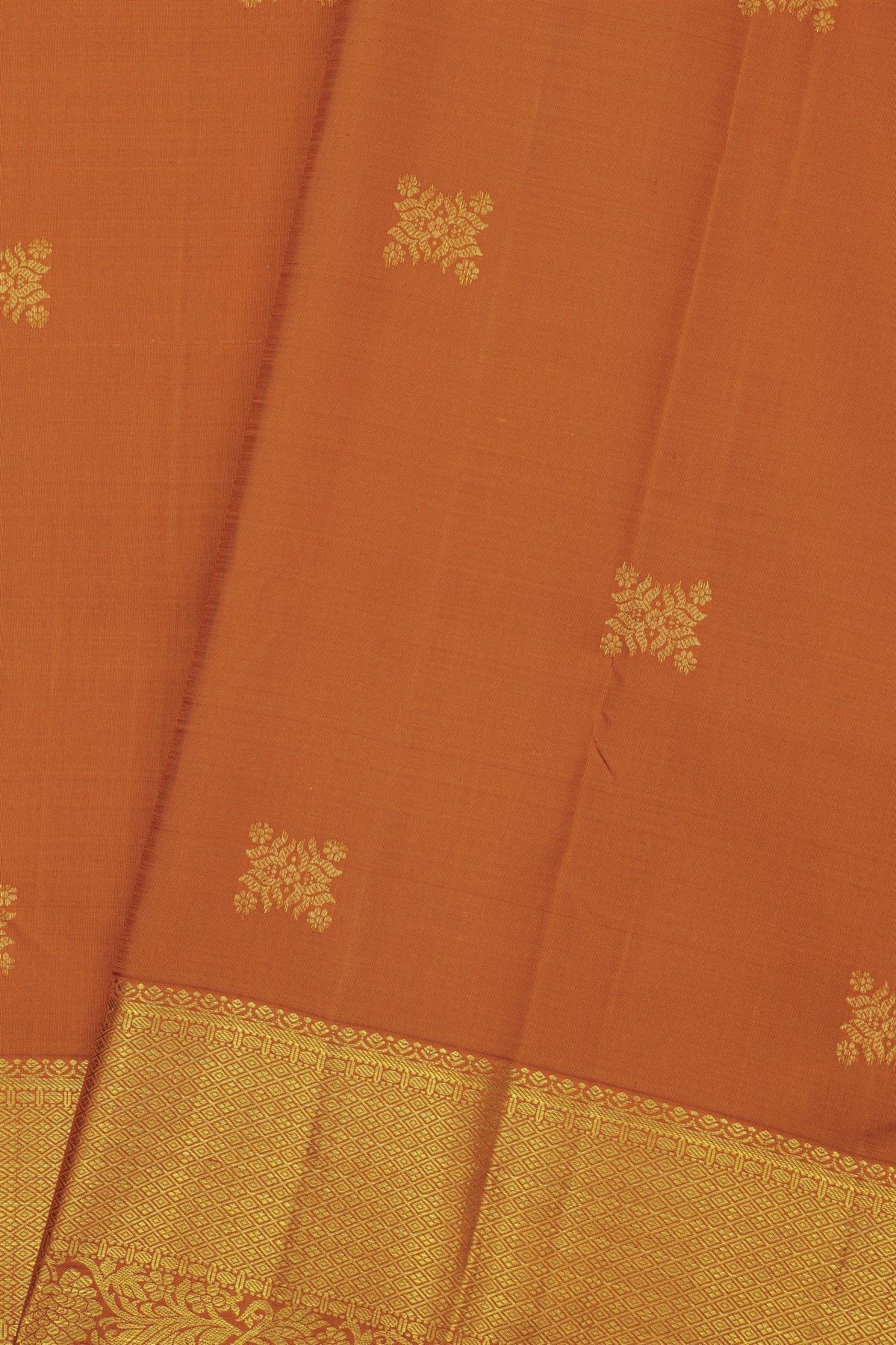 Kancheepuram Silk Rust Saree With Diamonds And Florals Border