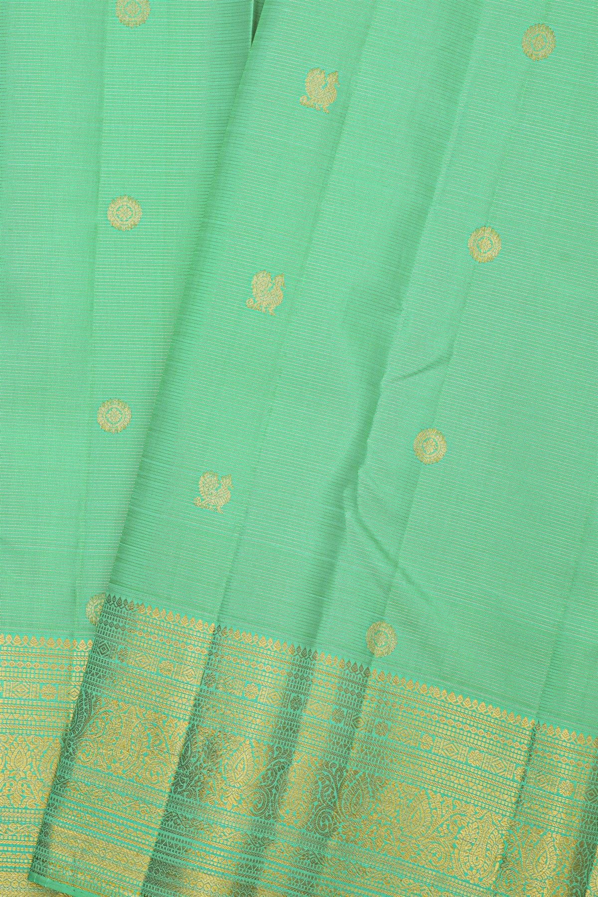 Kancheepuram Silk Sea Green Saree With Florals And Peacock Buttis Body