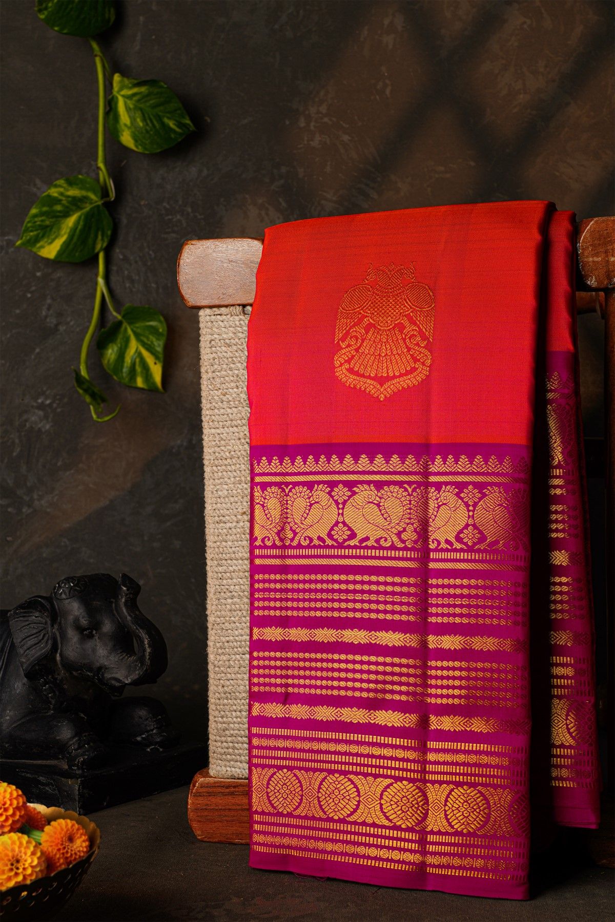 Kancheepuram Silk Orange Saree With Florals And Peacocks Buttis Border