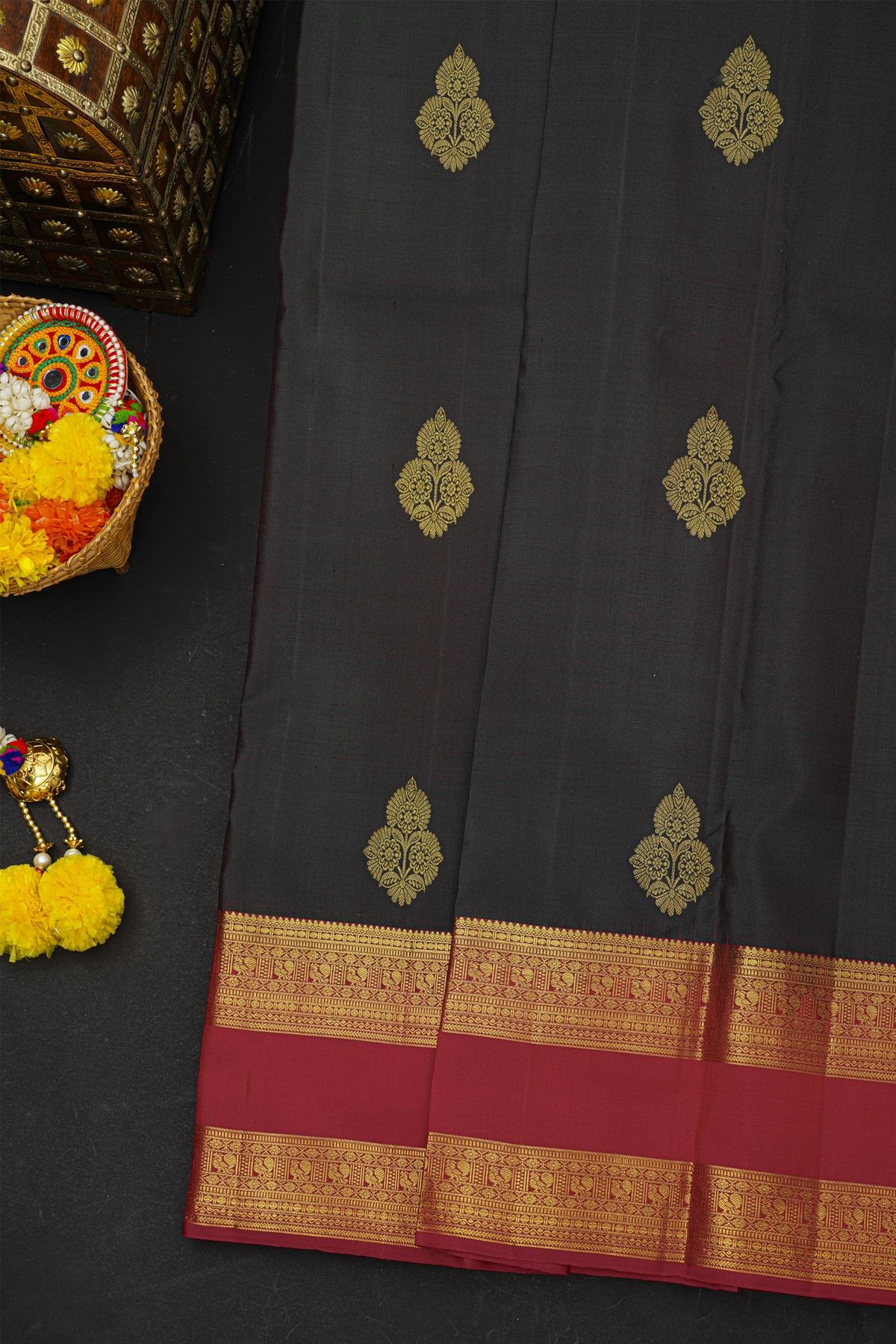 Kancheepuram Silk Black Saree With Floral Buttis Body And Gap Border