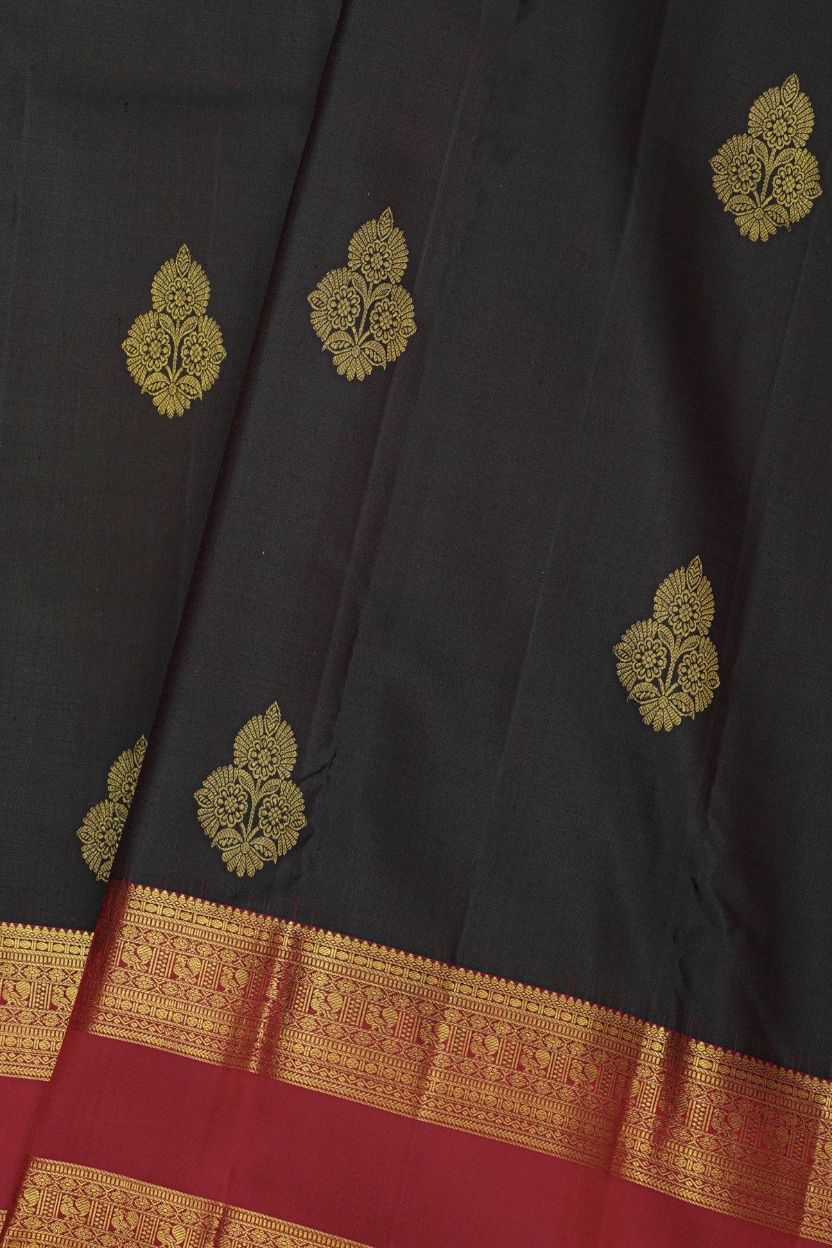 Kancheepuram Silk Black Saree With Floral Buttis Body And Gap Border