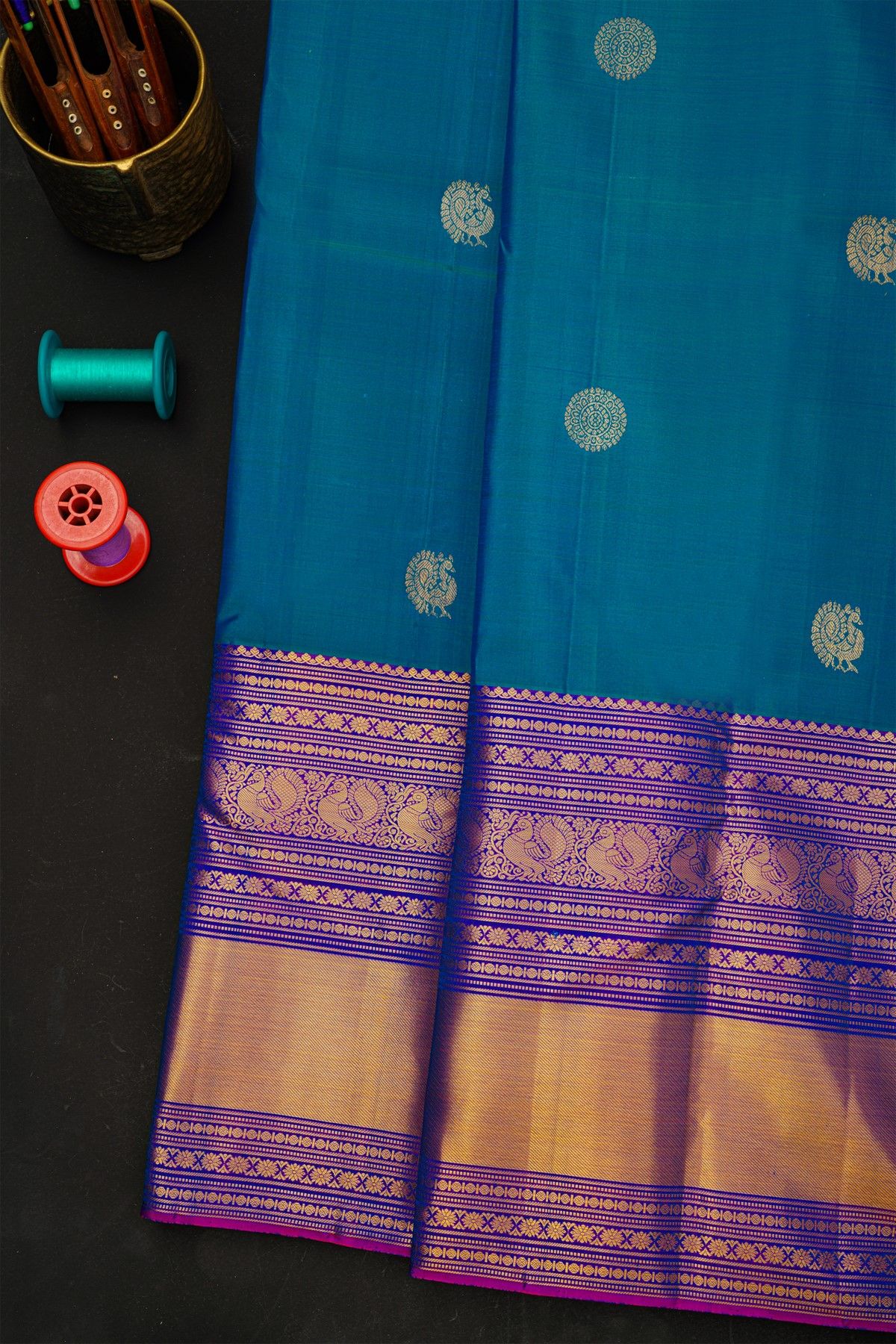 Kancheepuram Silk Blue Saree With Florals And Peacocks In Zari Body And Long Border