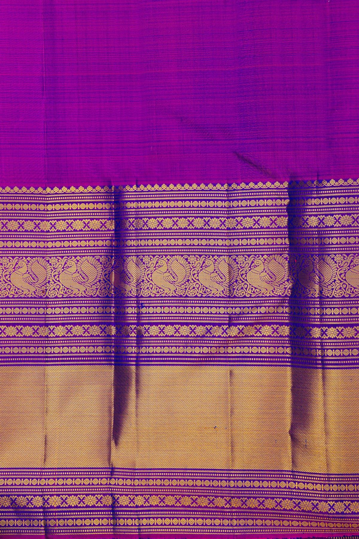 Kancheepuram Silk Blue Saree With Florals And Peacocks In Zari Body And Long Border