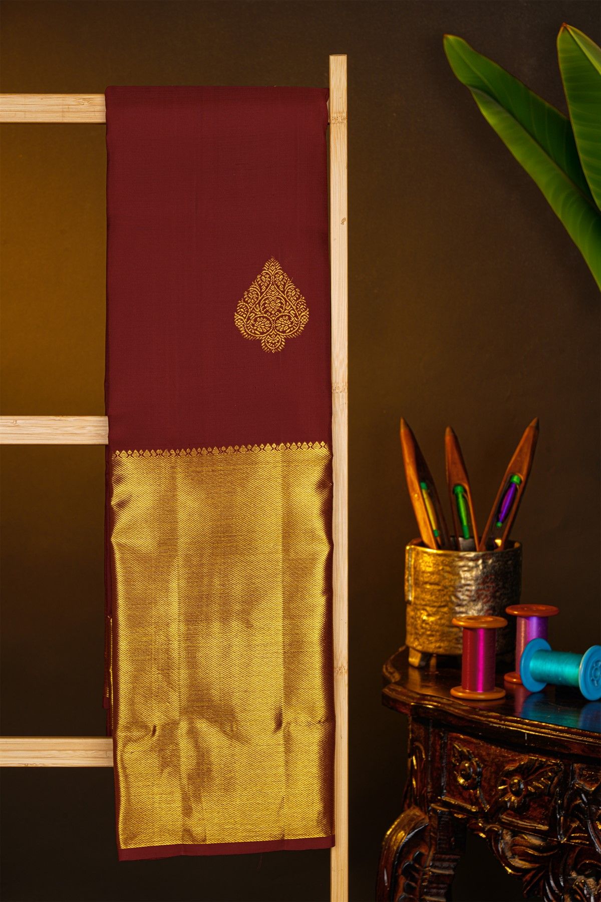 Kancheepuram Silk Maroon Saree With Florals And Leaves In Zari Body Long Kaddi Border