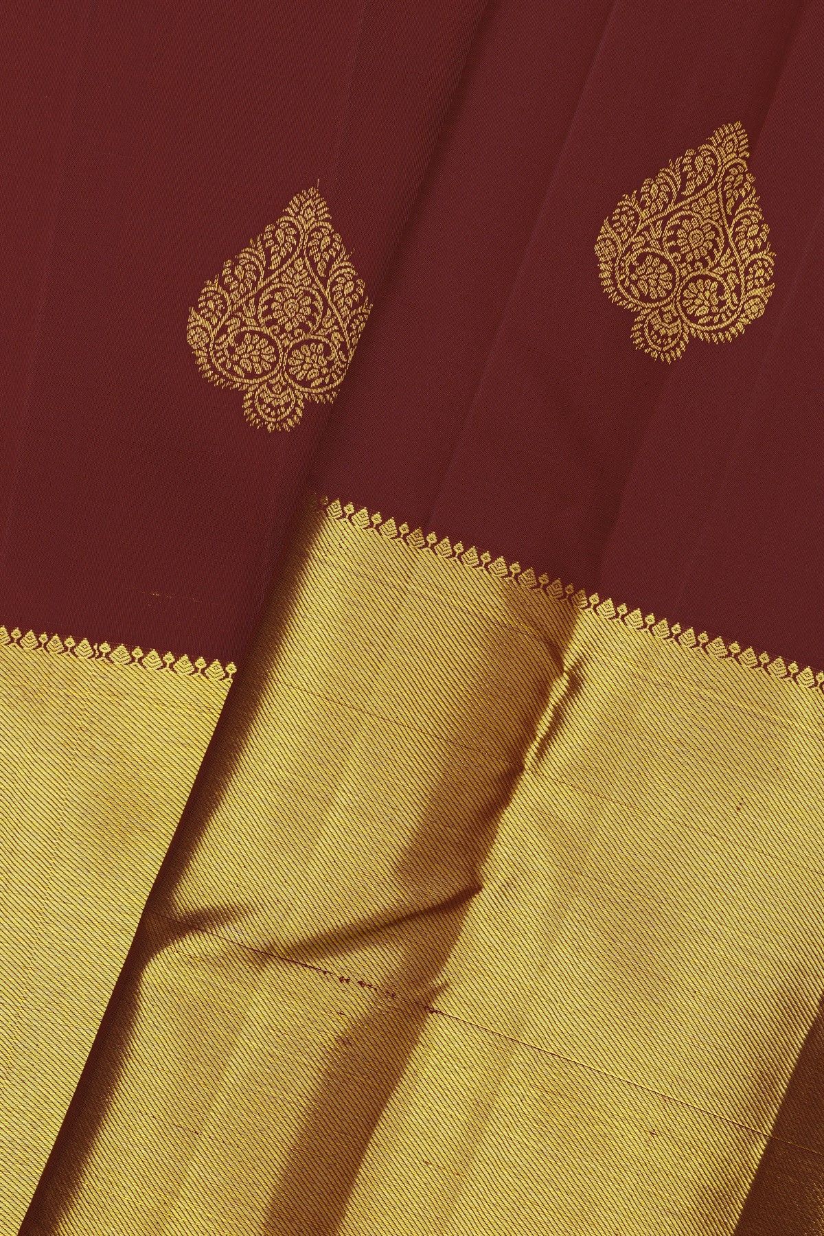 Kancheepuram Silk Maroon Saree With Florals And Leaves In Zari Body Long Kaddi Border