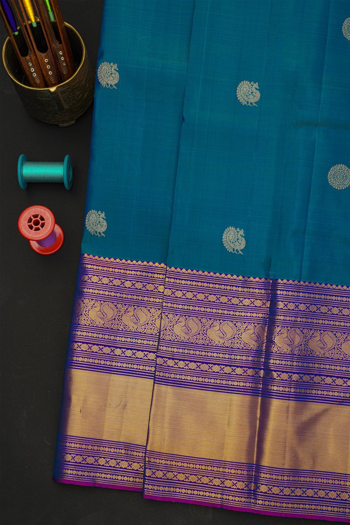 Kancheepuram Silk Blue Saree With Florals And Peacock Buttis In Zari Body