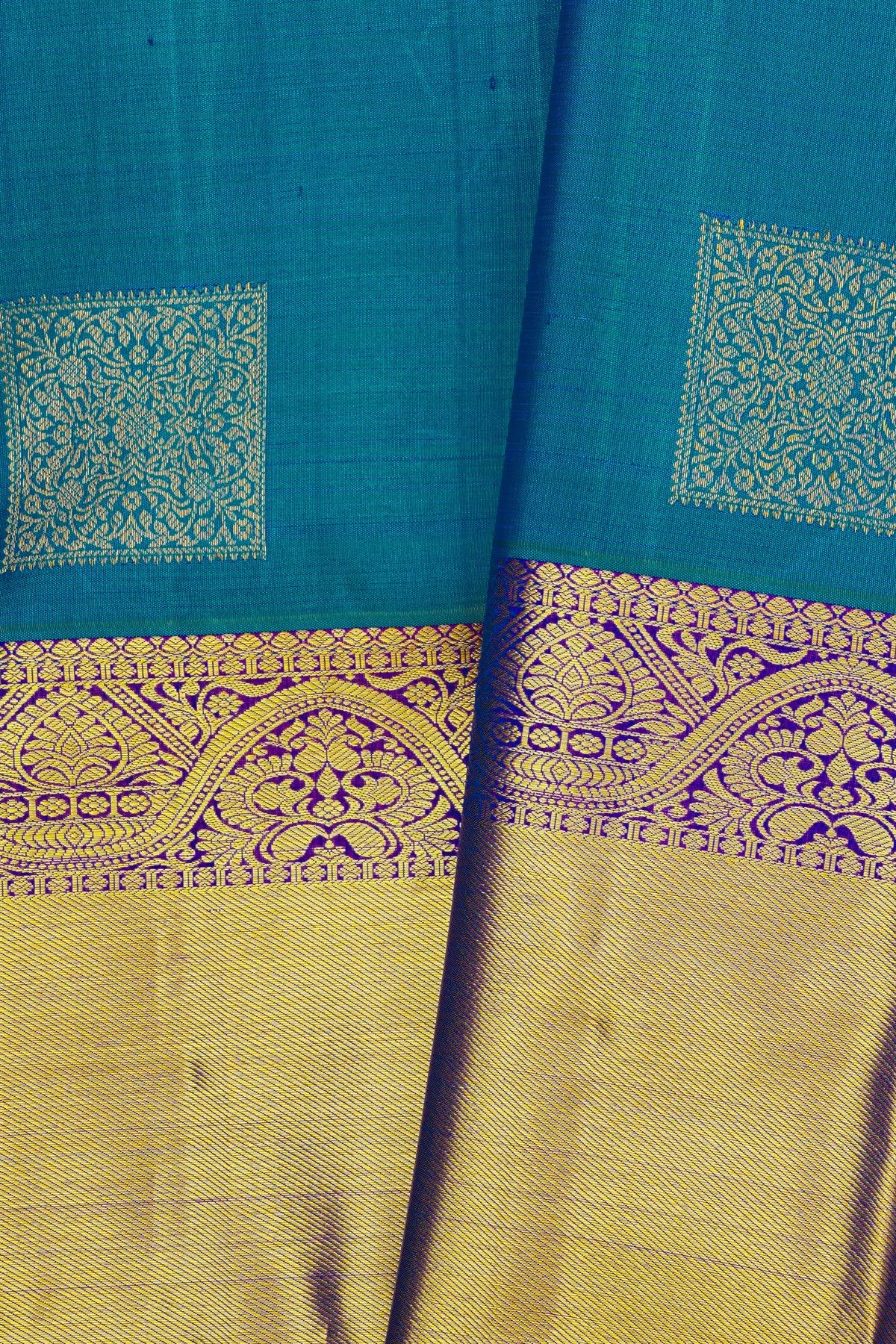 Kancheepuram Silk Peacock Blue Saree With Florals And Leaves Body And Kaddi Border
