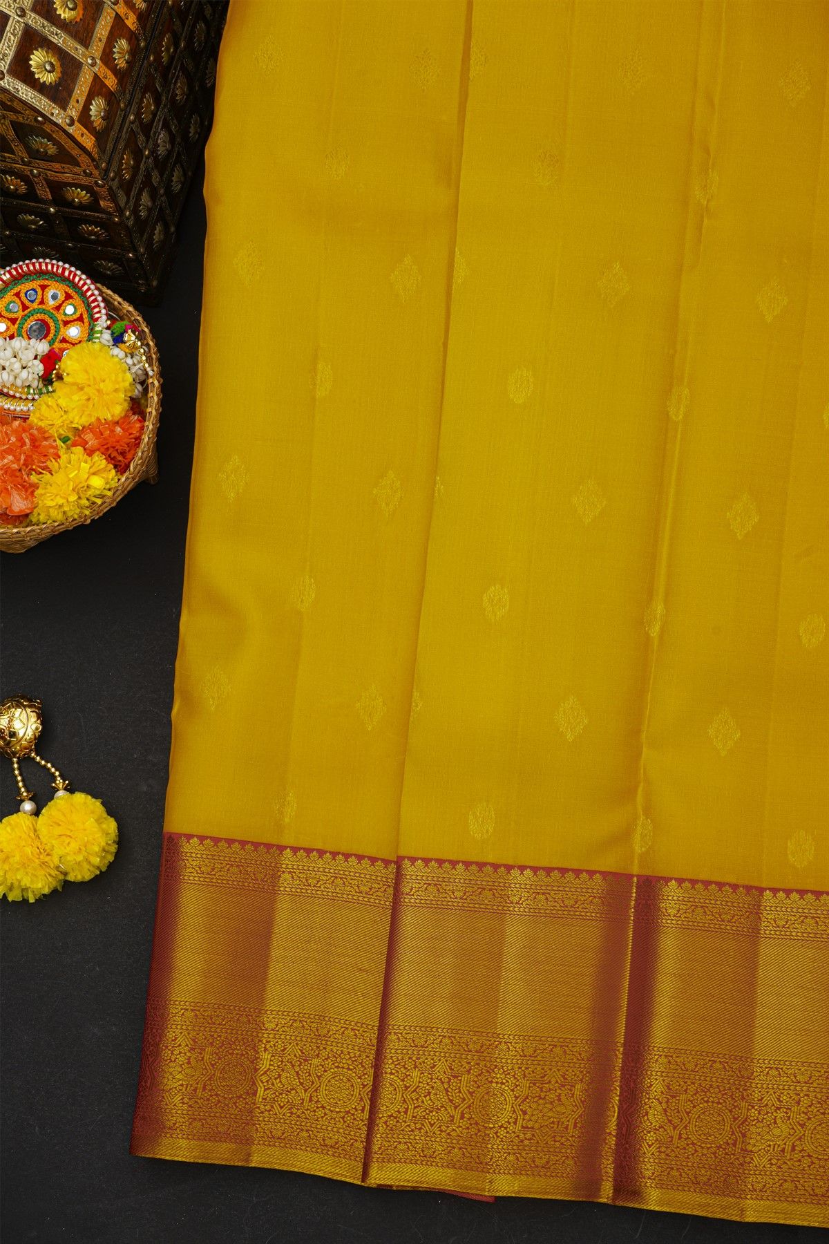 Kancheepuram Silk Mustard Saree With Cross Lines Florals And Peacocks Border