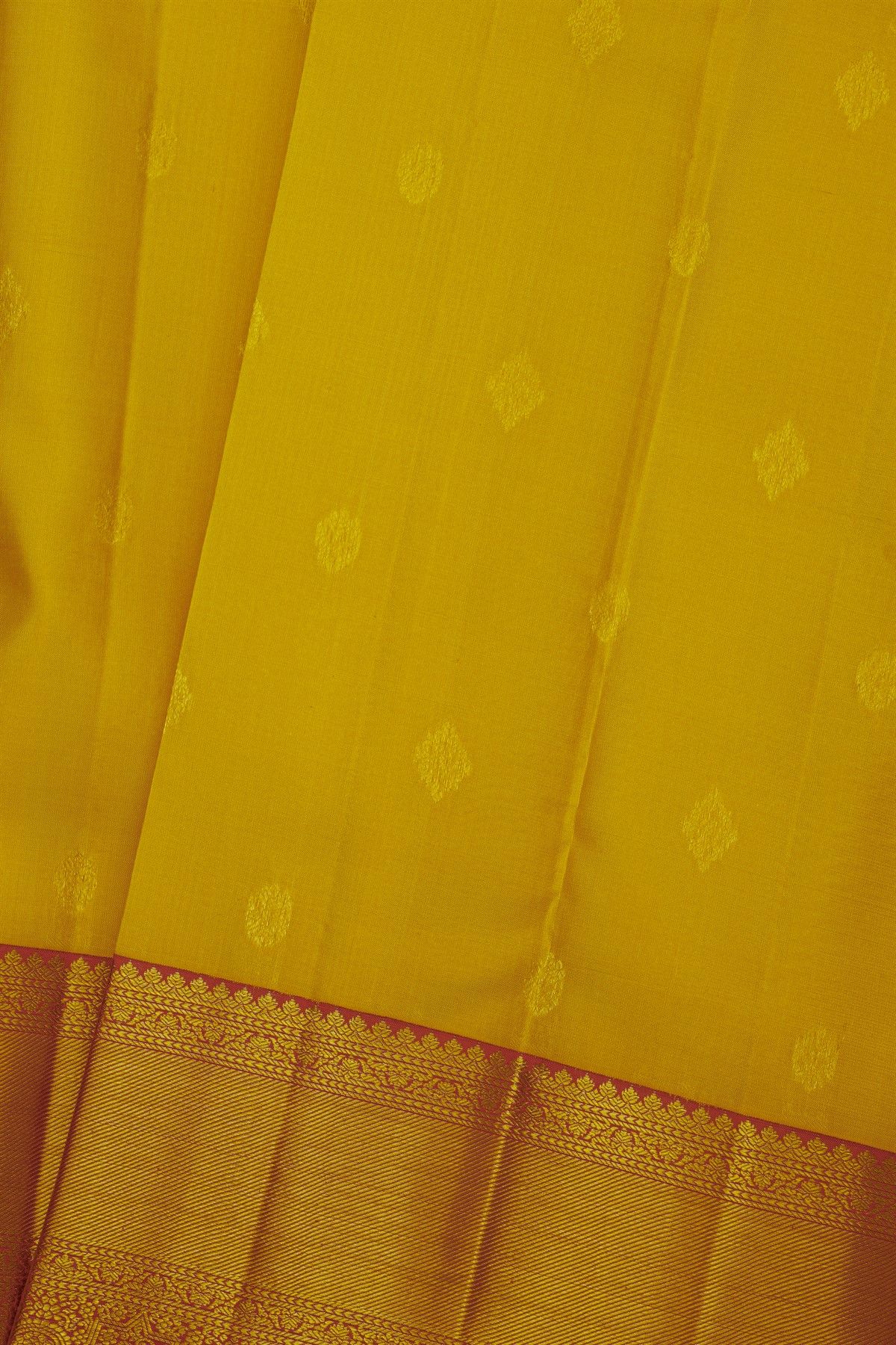 Kancheepuram Silk Mustard Saree With Cross Lines Florals And Peacocks Border