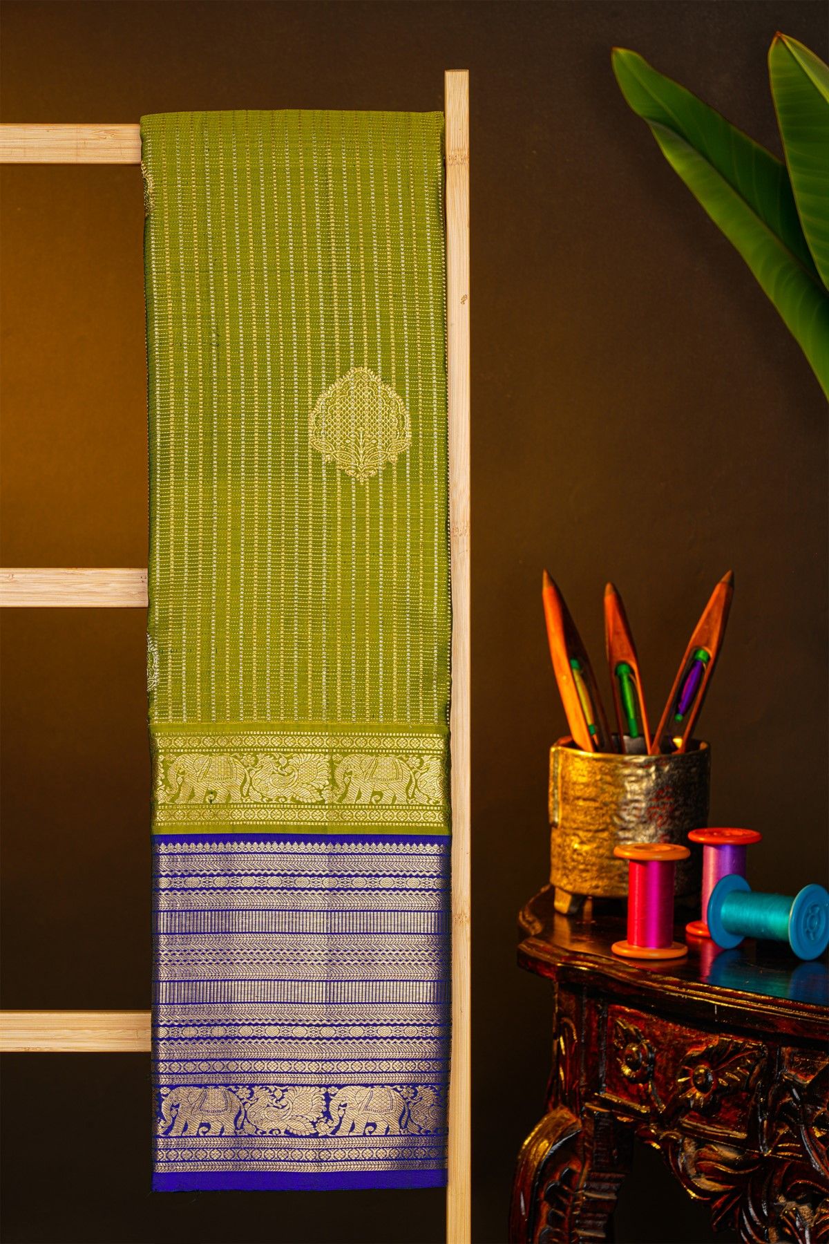 Kancheepuram Silk Leaf Green Saree With Zari Checks And Floral Buttis Body