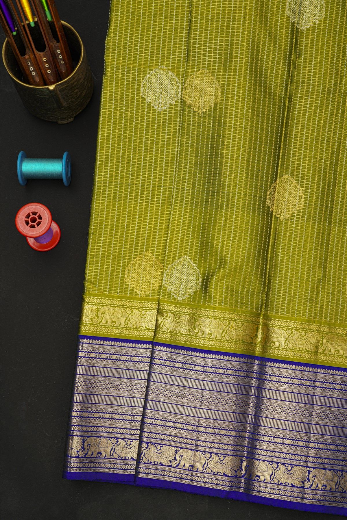 Kancheepuram Silk Leaf Green Saree With Zari Checks And Floral Buttis Body