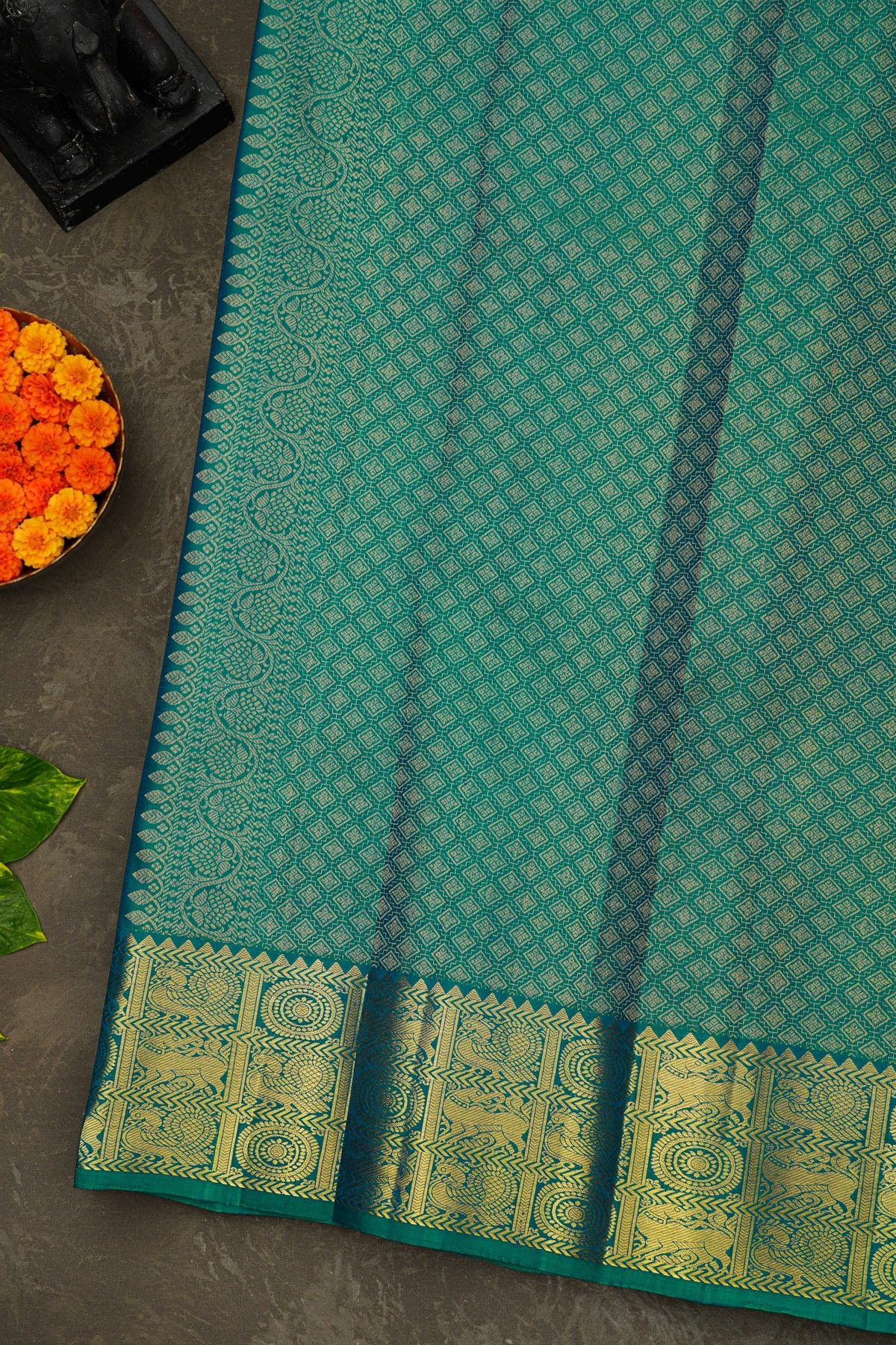 Kancheepuram Silk Teal Green Saree With Florals Peacocks And Yalli Border