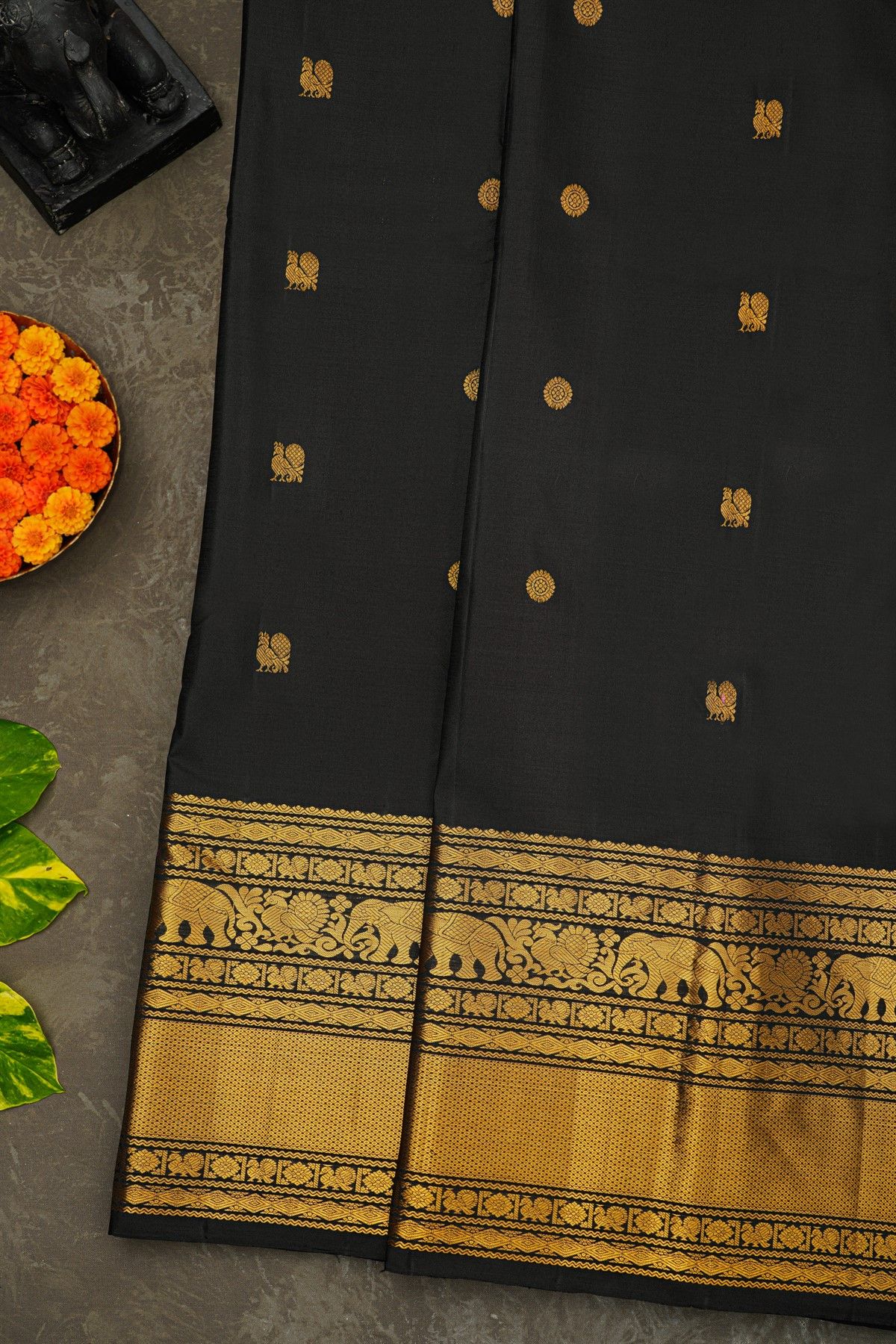 Kancheepuram Silk Black Saree With Florals And Peacock Buttis Body