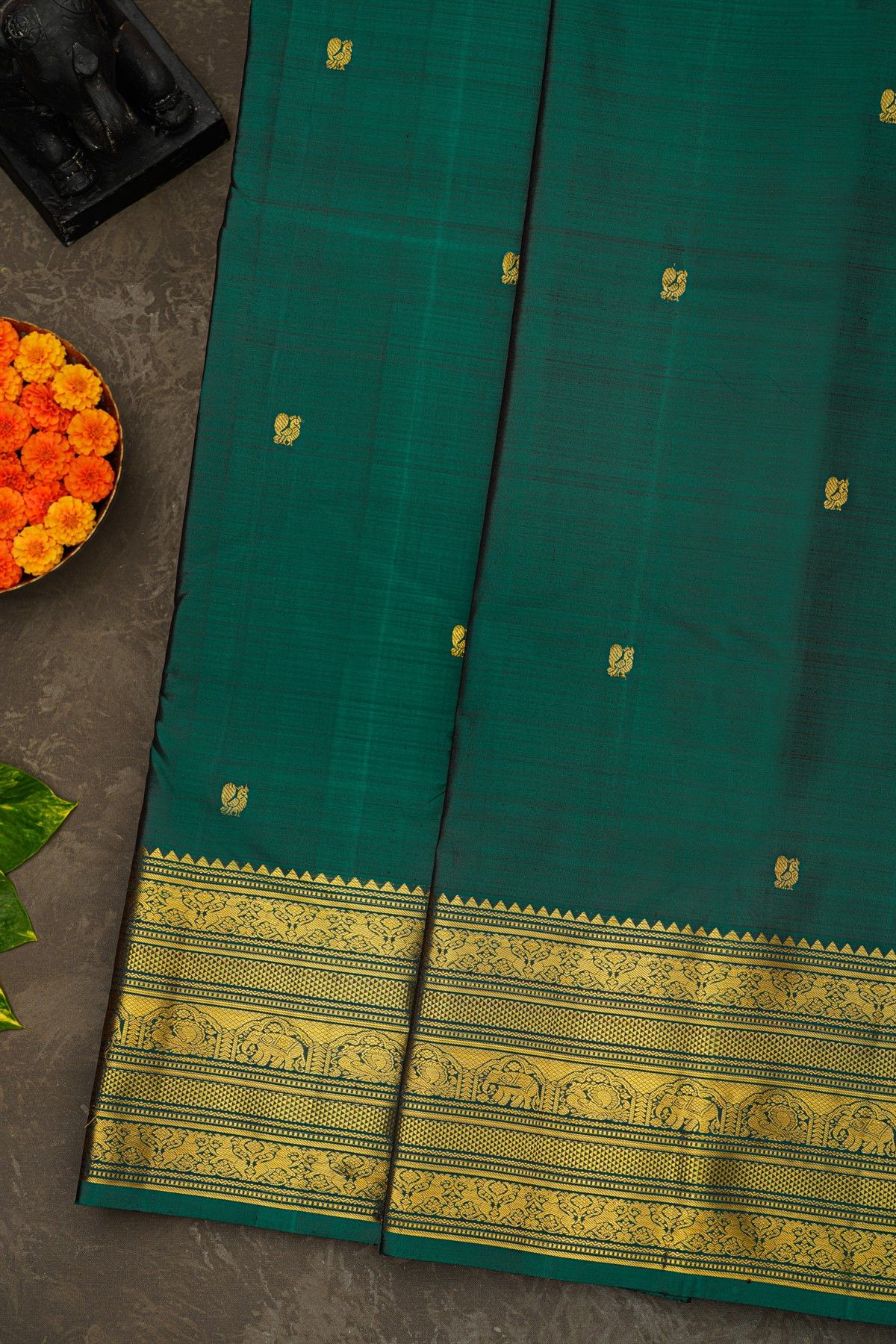 Kancheepuram Silk Bottle Green Saree With Floral Peacock And Elephant Zari Border