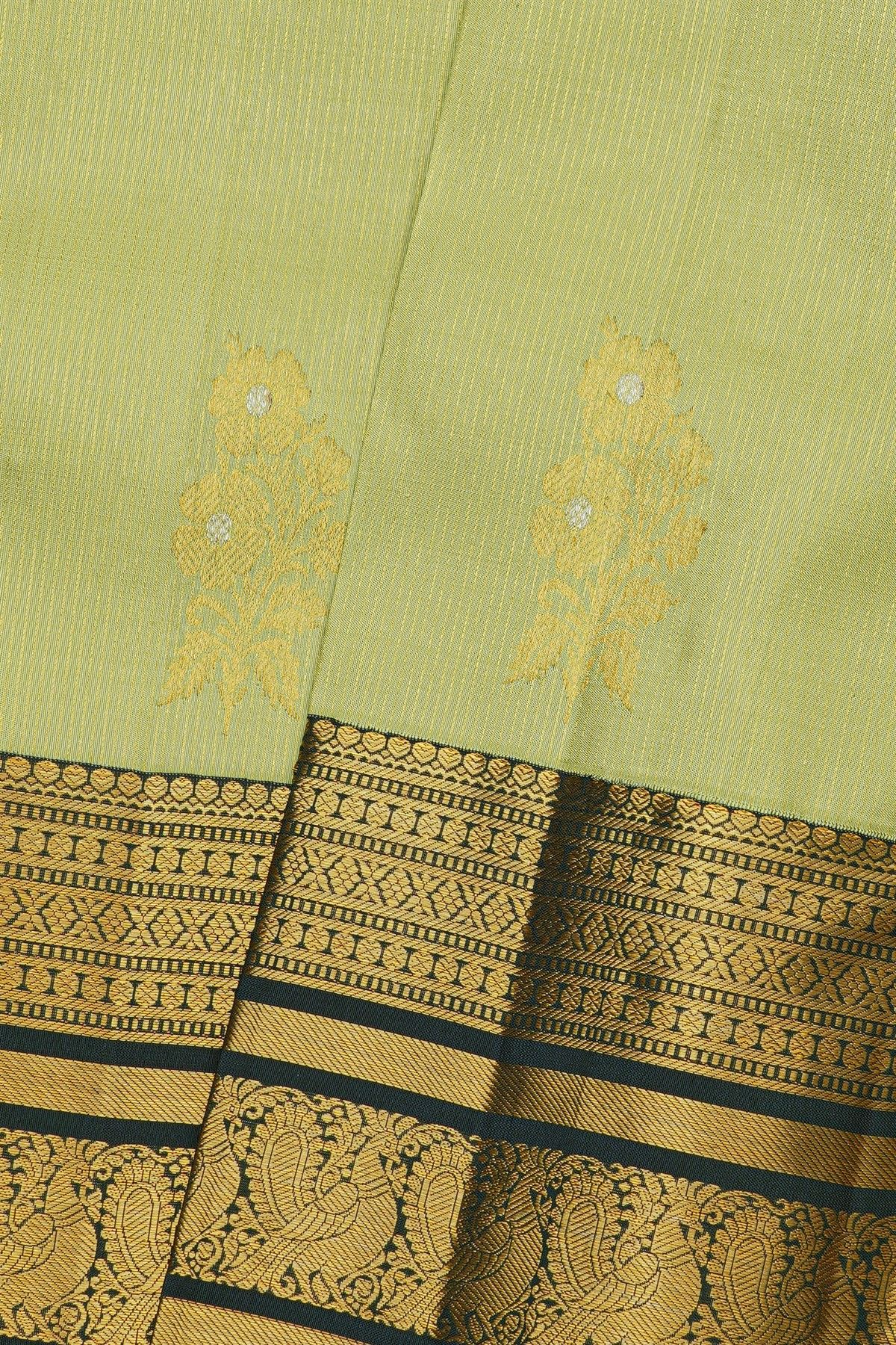 Kancheepuram Silk Light Green Saree With Florals And Peacocks Border