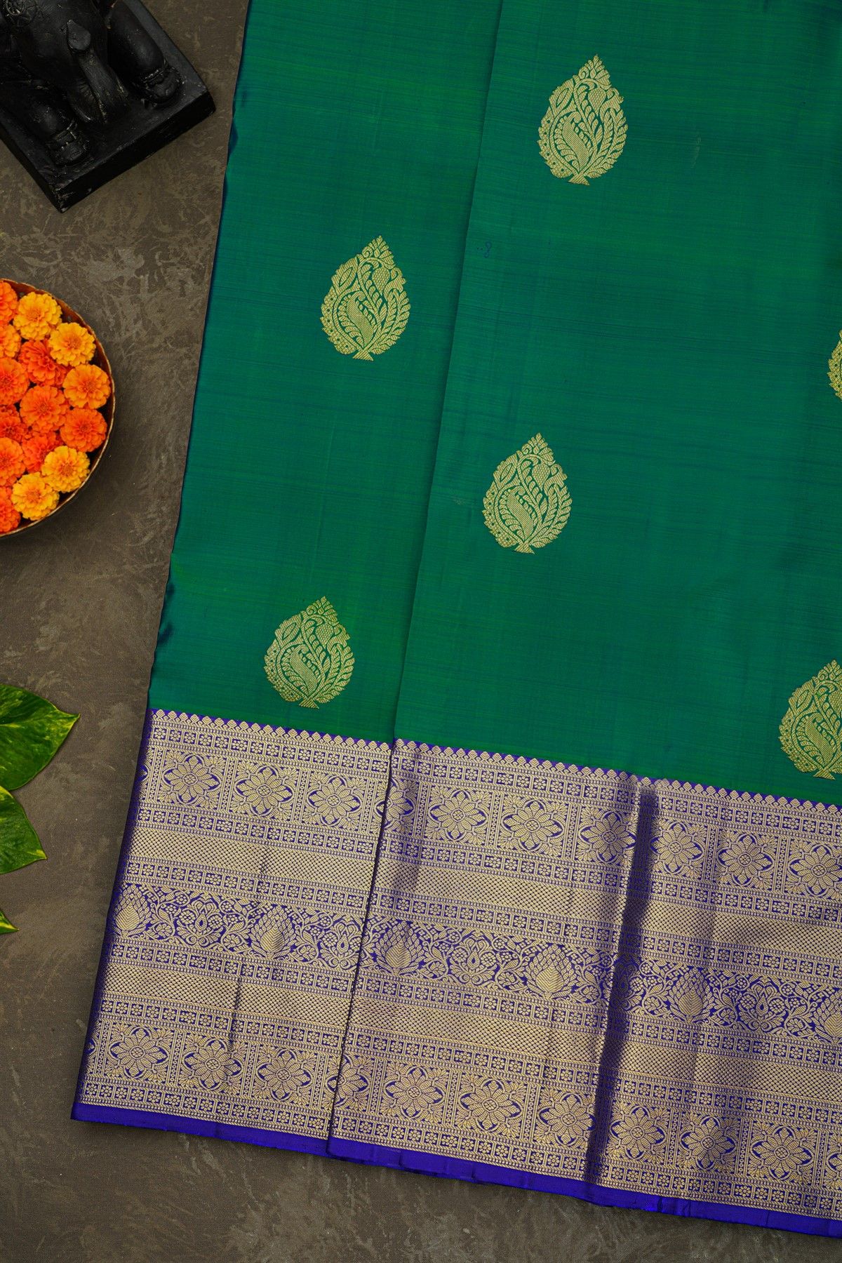 Kancheepuram Silk Peacock Green Saree With Florals And Leaves Border
