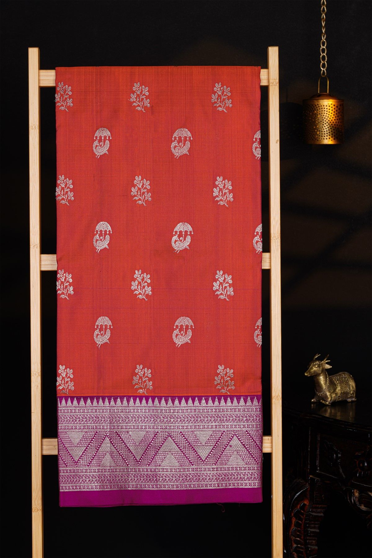 Venkatagiri Silk Rust Orange Saree With Florals And Peacock Buttis Body