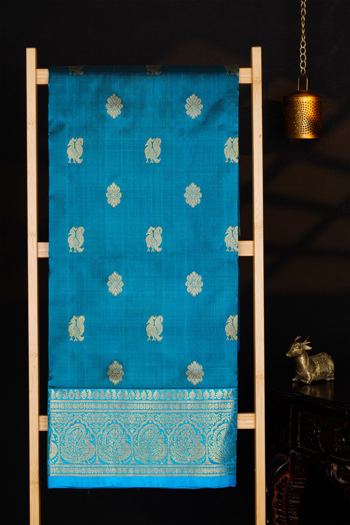 Venkatagiri Silk Royal Blue Saree With Florals And Peacock Buttis Body