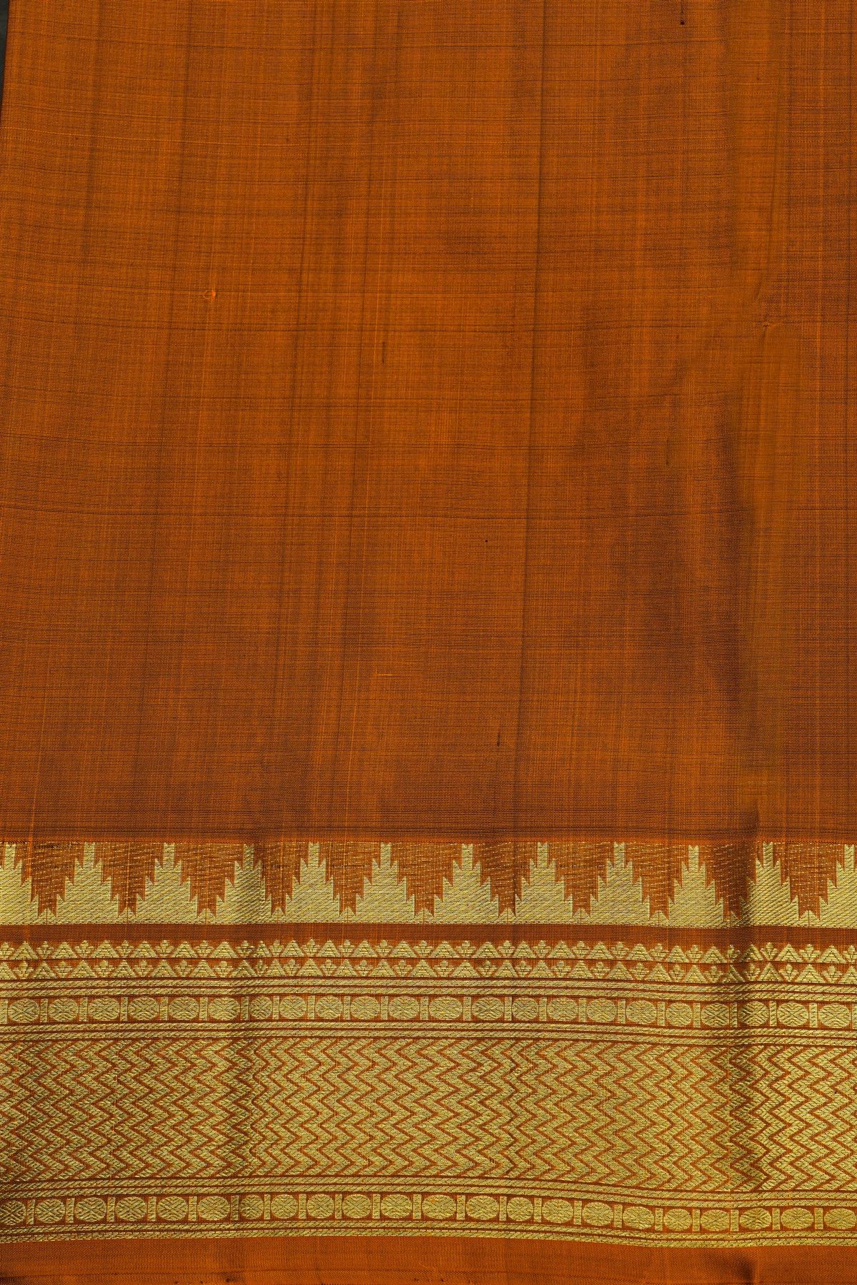 Venkatagiri Silk Rust Orange Saree With Zari Checks And Peacock Buttis Body