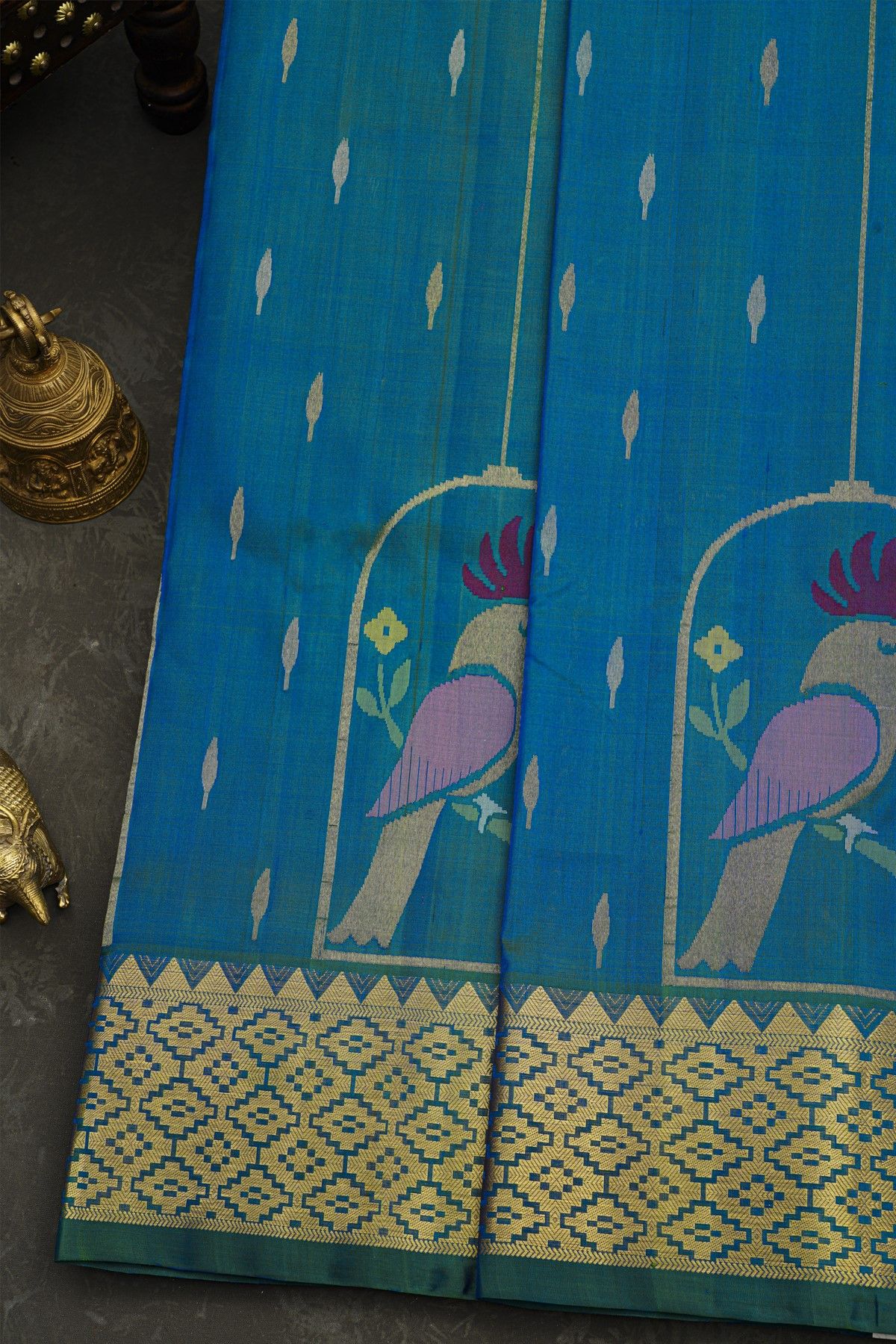 Venkatagiri Silk Royal Blue Saree With Florals And Parrot Buttis Body