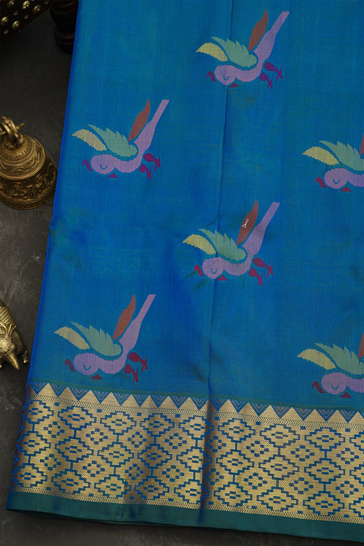 Venkatagiri Silk Royal Blue Saree With Florals And Parrot Buttis Body