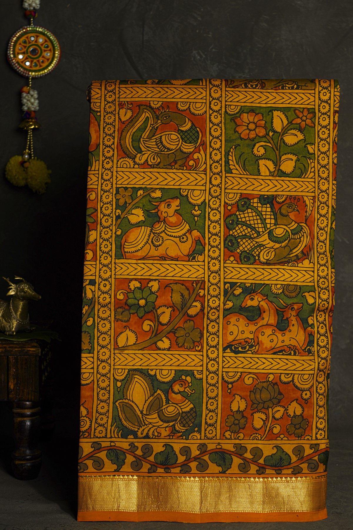 Kalamkari Silk Orange Saree With Cross Lines In Zari Border