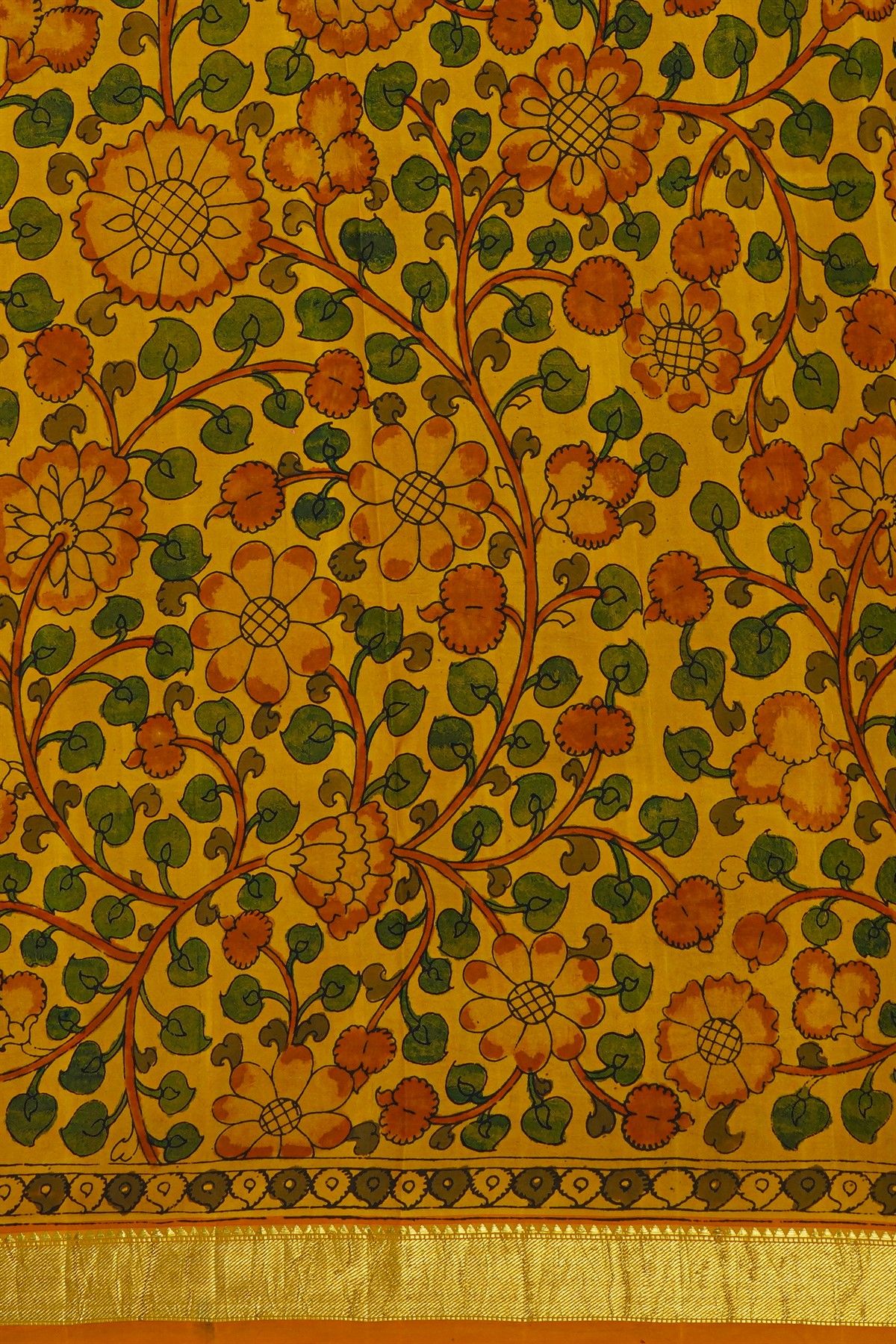 Kalamkari Silk Orange Saree With Cross Lines In Zari Border