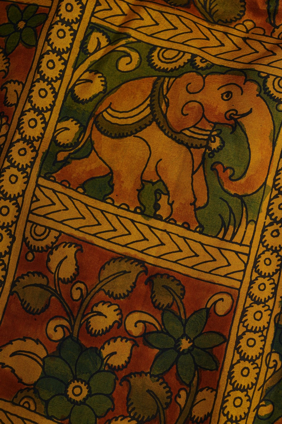 Kalamkari Silk Orange Saree With Cross Lines In Zari Border