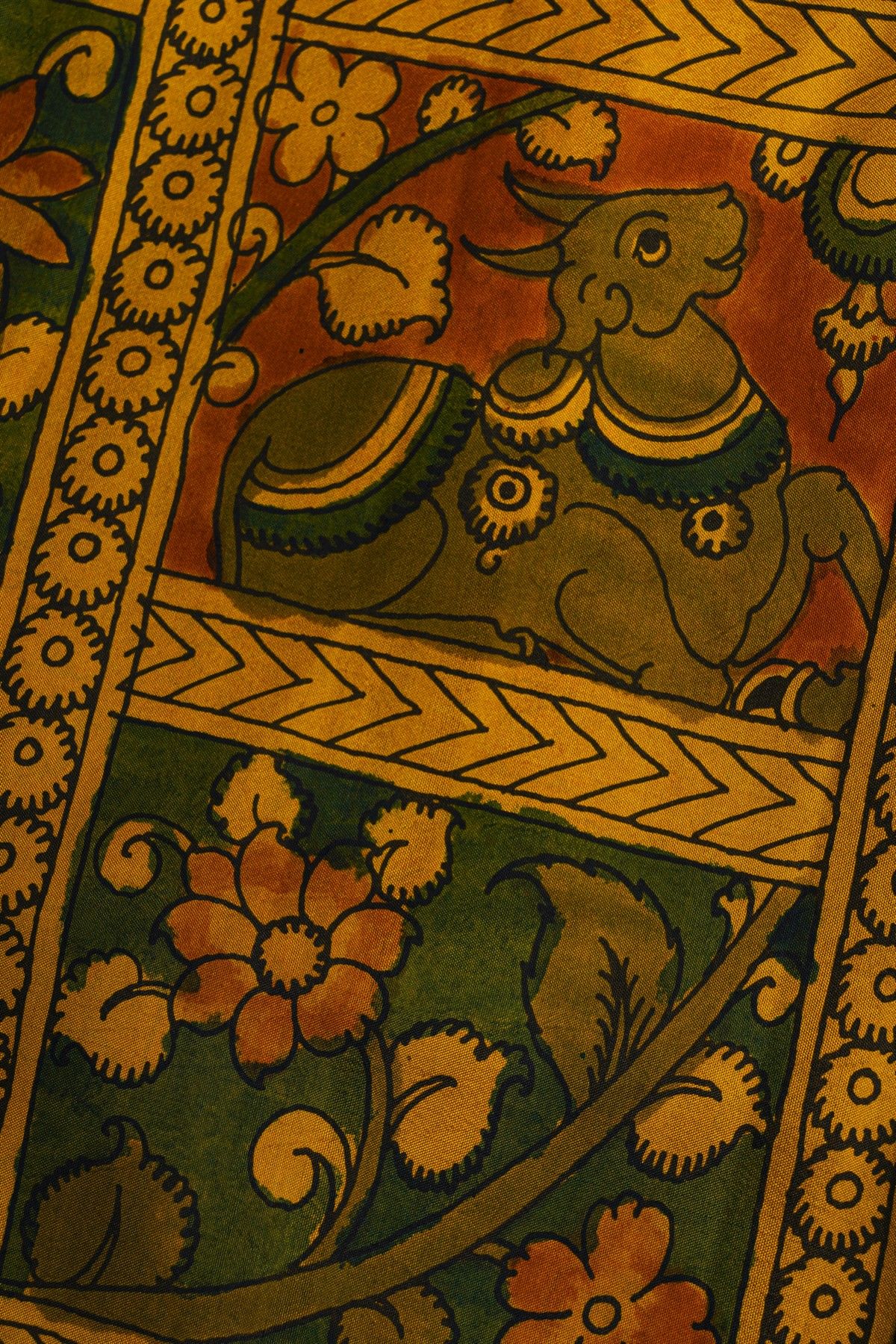 Kalamkari Silk Orange Saree With Cross Lines In Zari Border