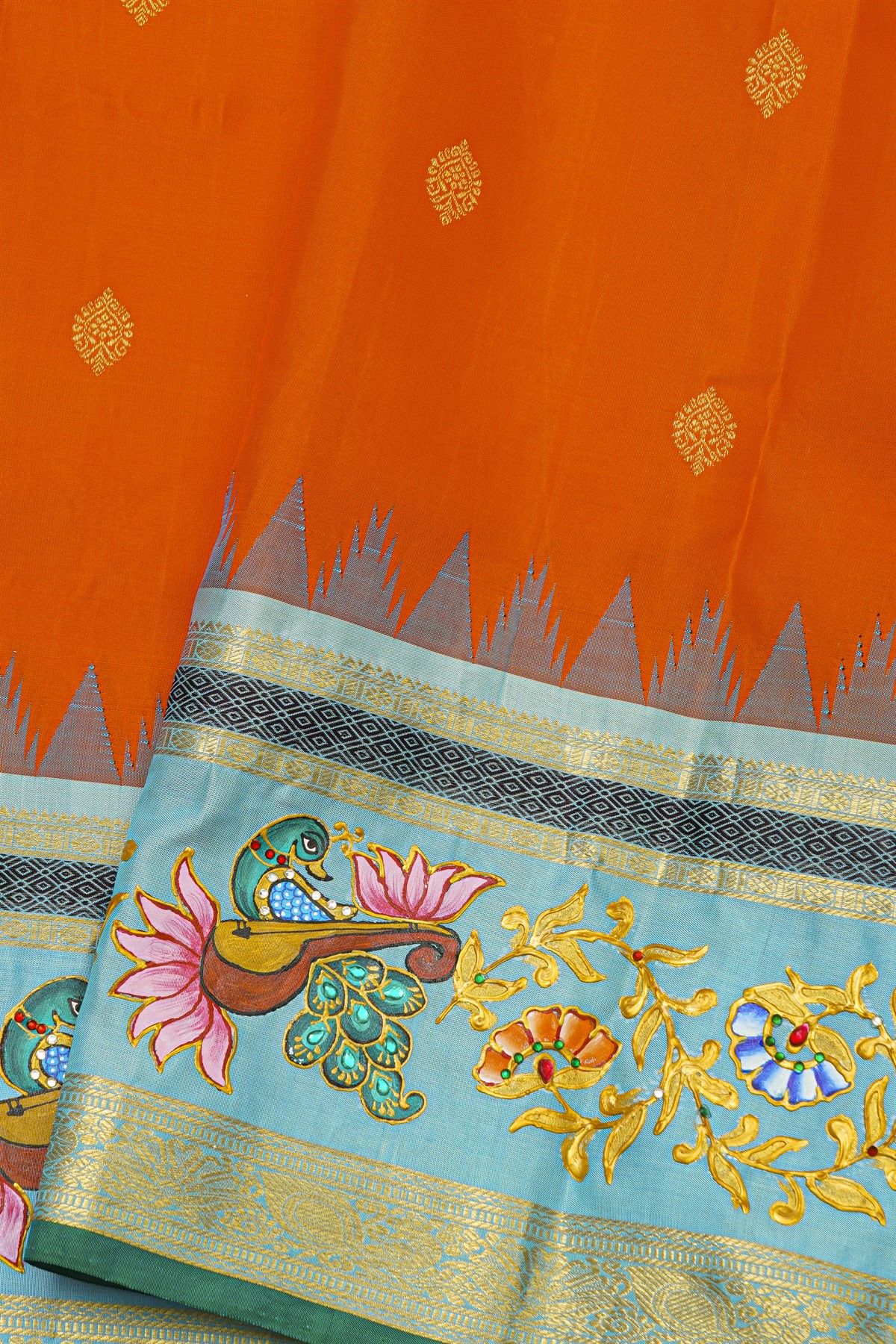 Gadwal Silk Orange Saree With Tanjore Hand-Painted Veena Peacock & Floral Zari Border