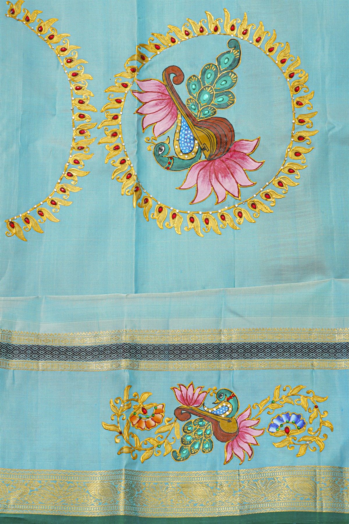 Gadwal Silk Orange Saree With Tanjore Hand-Painted Veena Peacock & Floral Zari Border