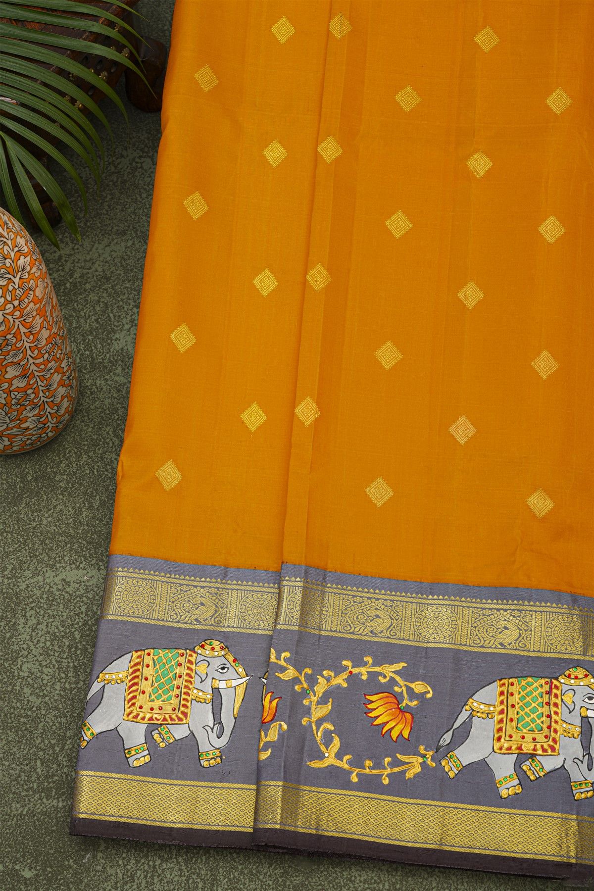 Gadwal Silk Orange Saree With Tanjore Hand-Painted Florals And Elephants Border