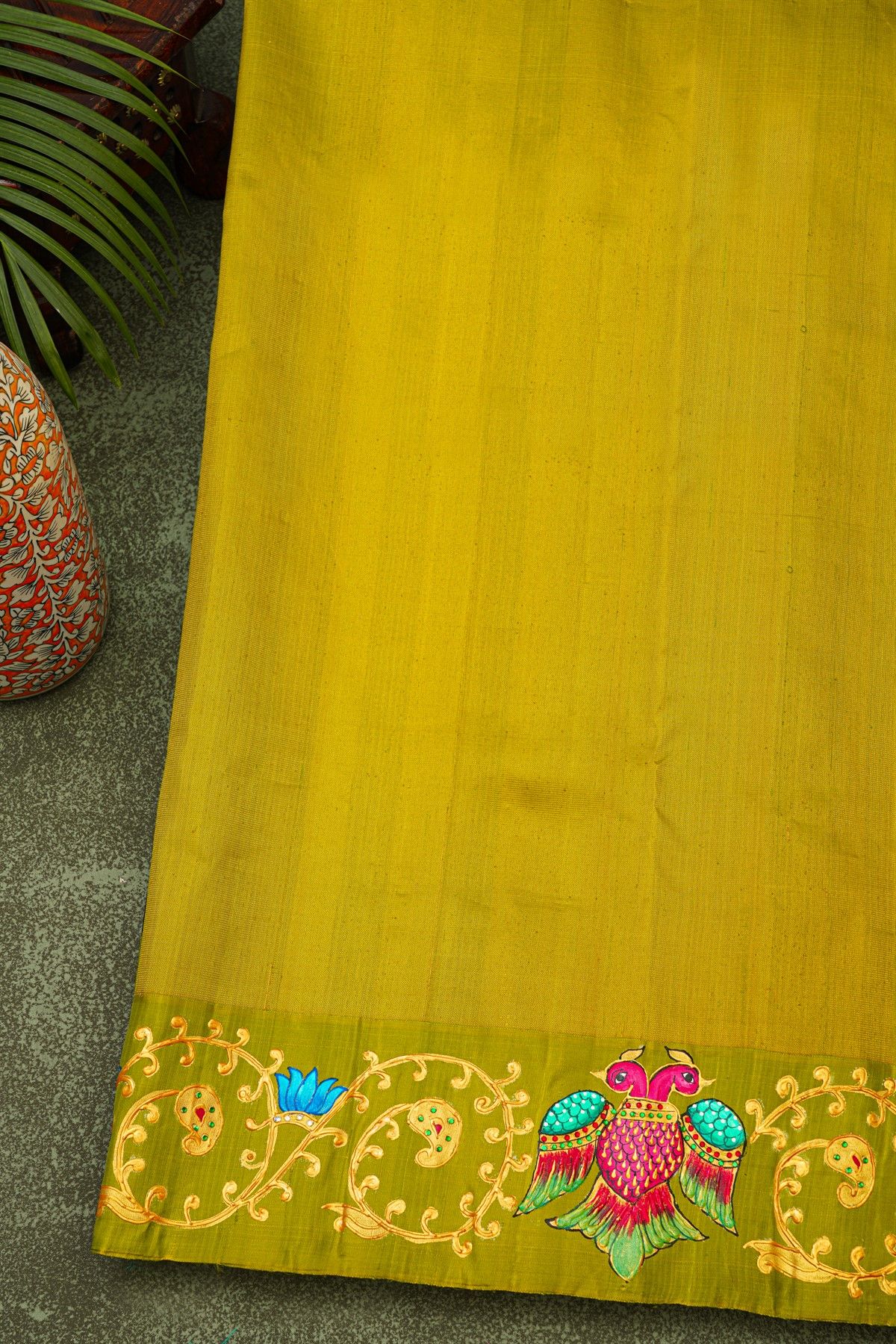 Gadwal Silk Bottle Green Saree With Tanjore Hand-Painted Florals And Gandaberunda Border