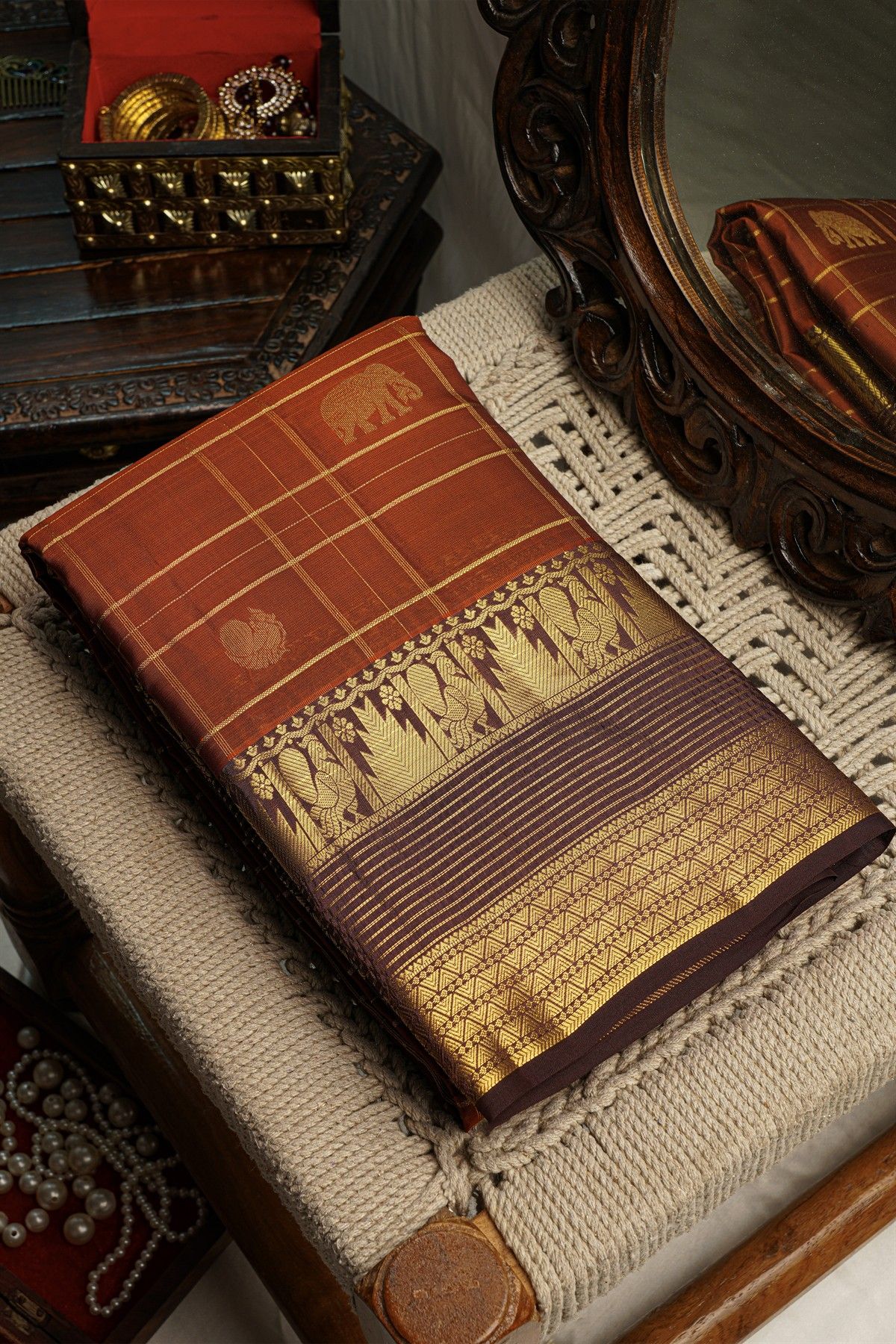 Kancheepuram Silk Rust Saree With Checks And Traditional Border