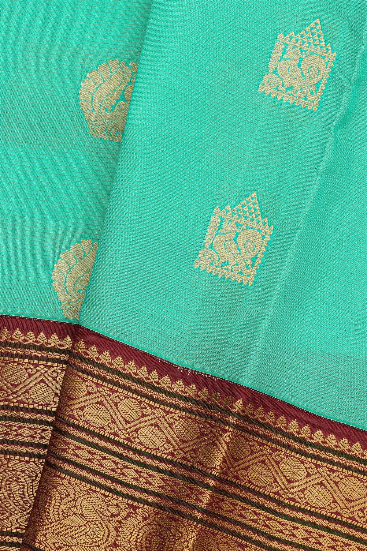 Kancheepuram Silk Sea Green Saree With Zari Lines Body Peacocks Traditional Border