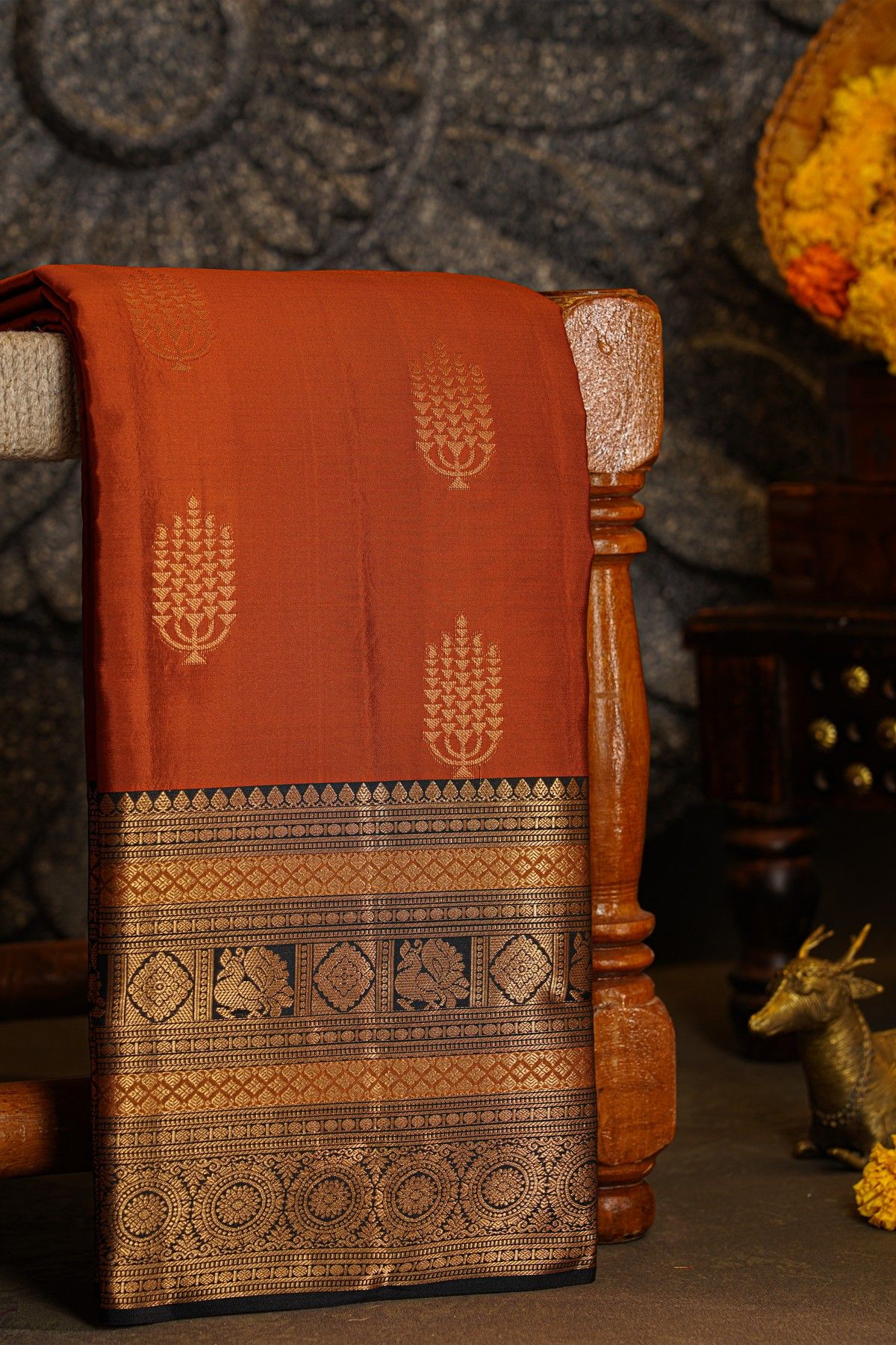 Kancheepuram Silk Rust Black Saree With Florals And Peacocks Border