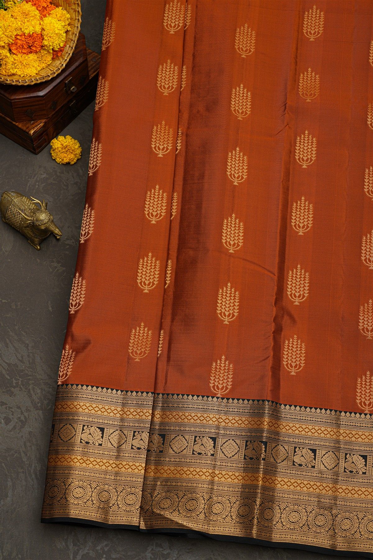 Kancheepuram Silk Rust Black Saree With Florals And Peacocks Border