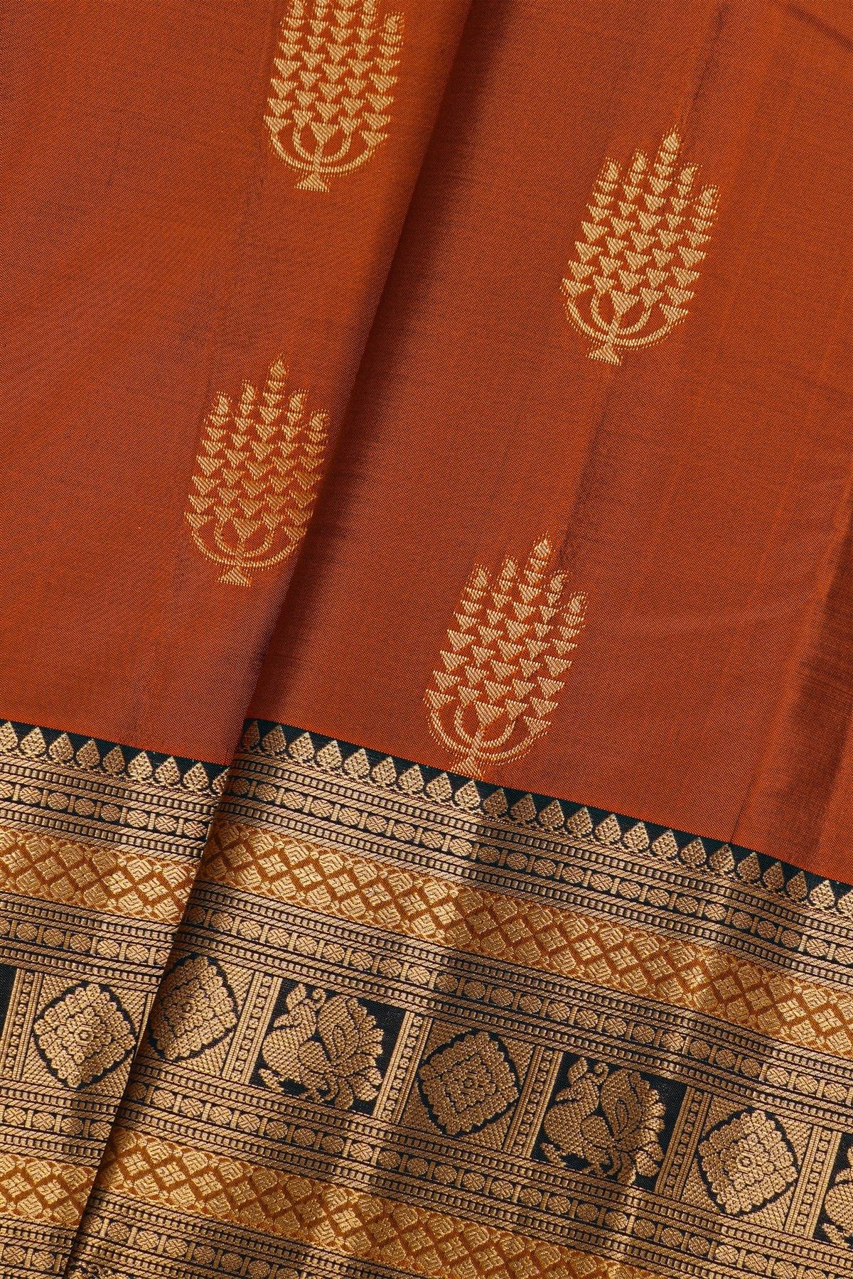 Kancheepuram Silk Rust Black Saree With Florals And Peacocks Border