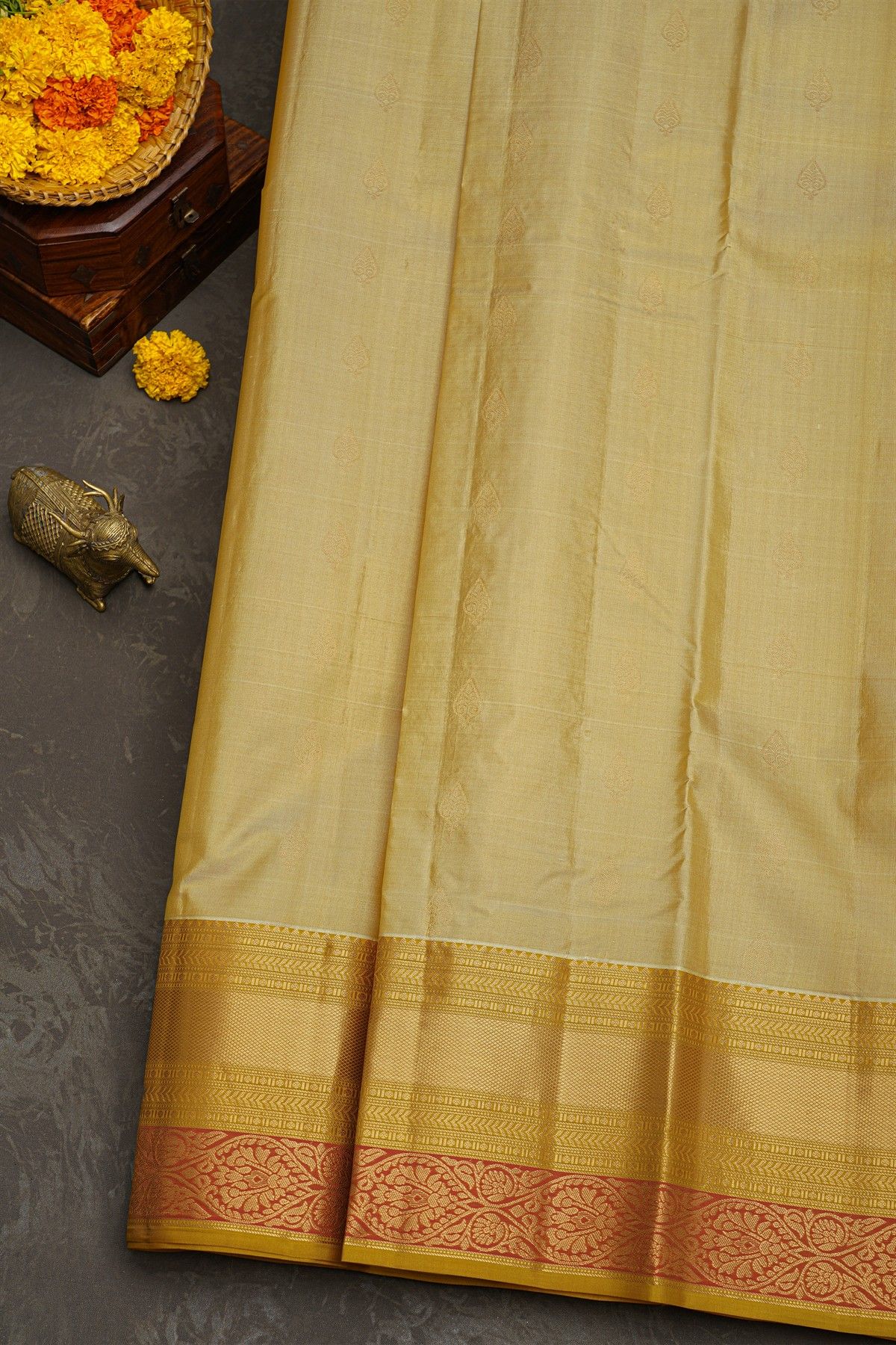 Kancheepuram Silk Cream Saree With Florals And Leaves With Diamonds Border