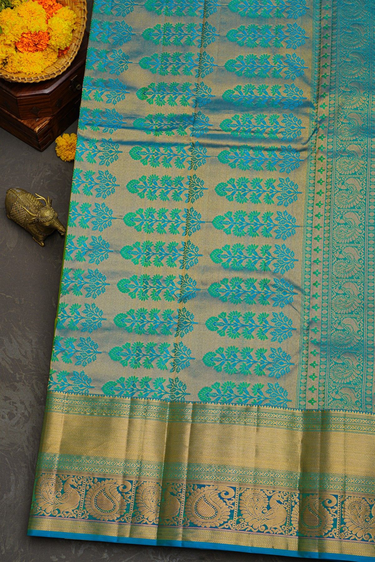 Kancheepuram Silk Green Saree With Florals And Peacocks In Cross Lines Border