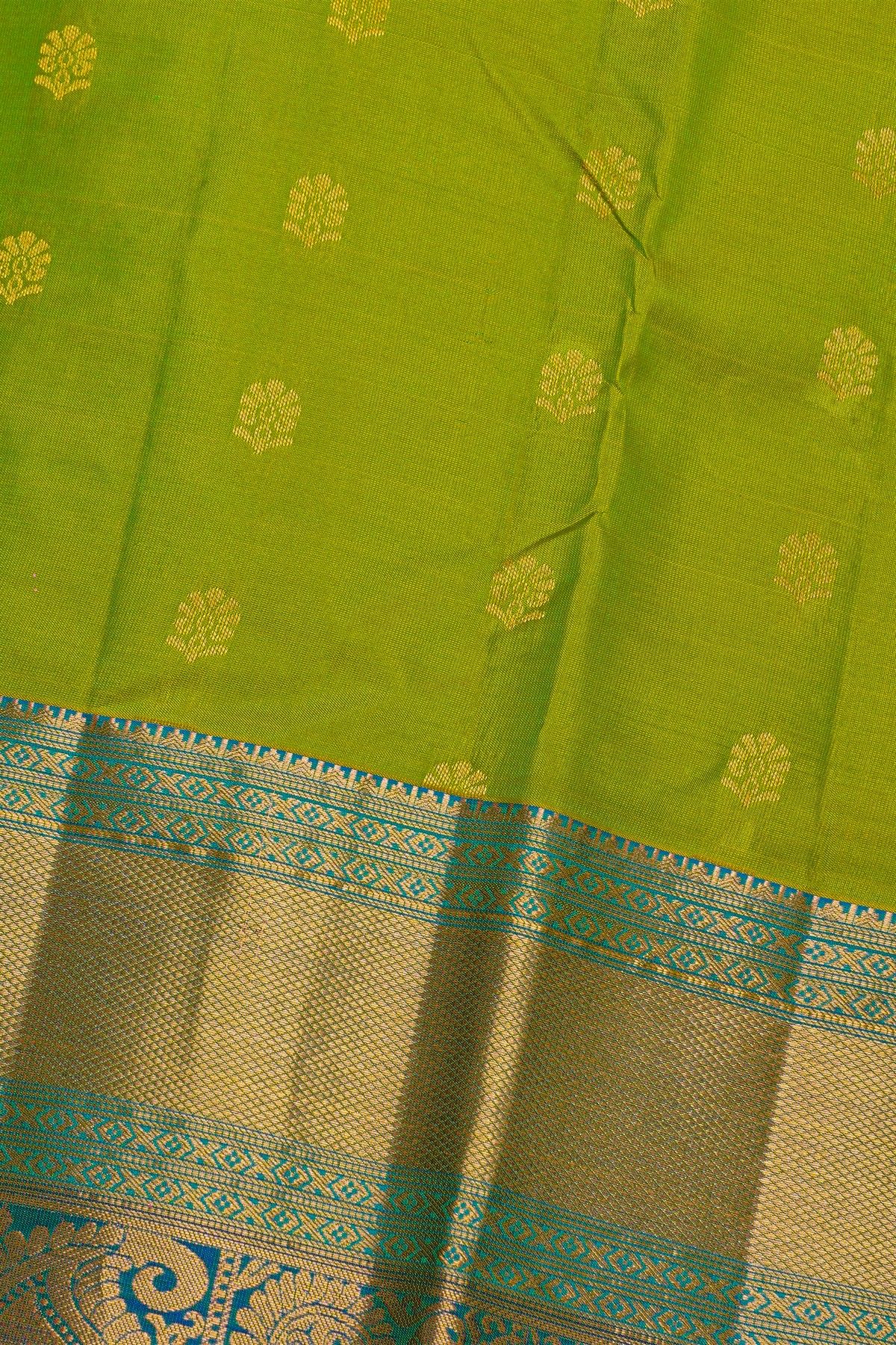 Kancheepuram Silk Green Saree With Florals And Peacocks In Cross Lines Border