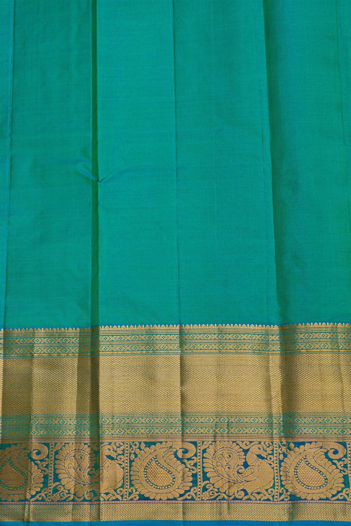 Kancheepuram Silk Green Saree With Florals And Peacocks In Cross Lines Border